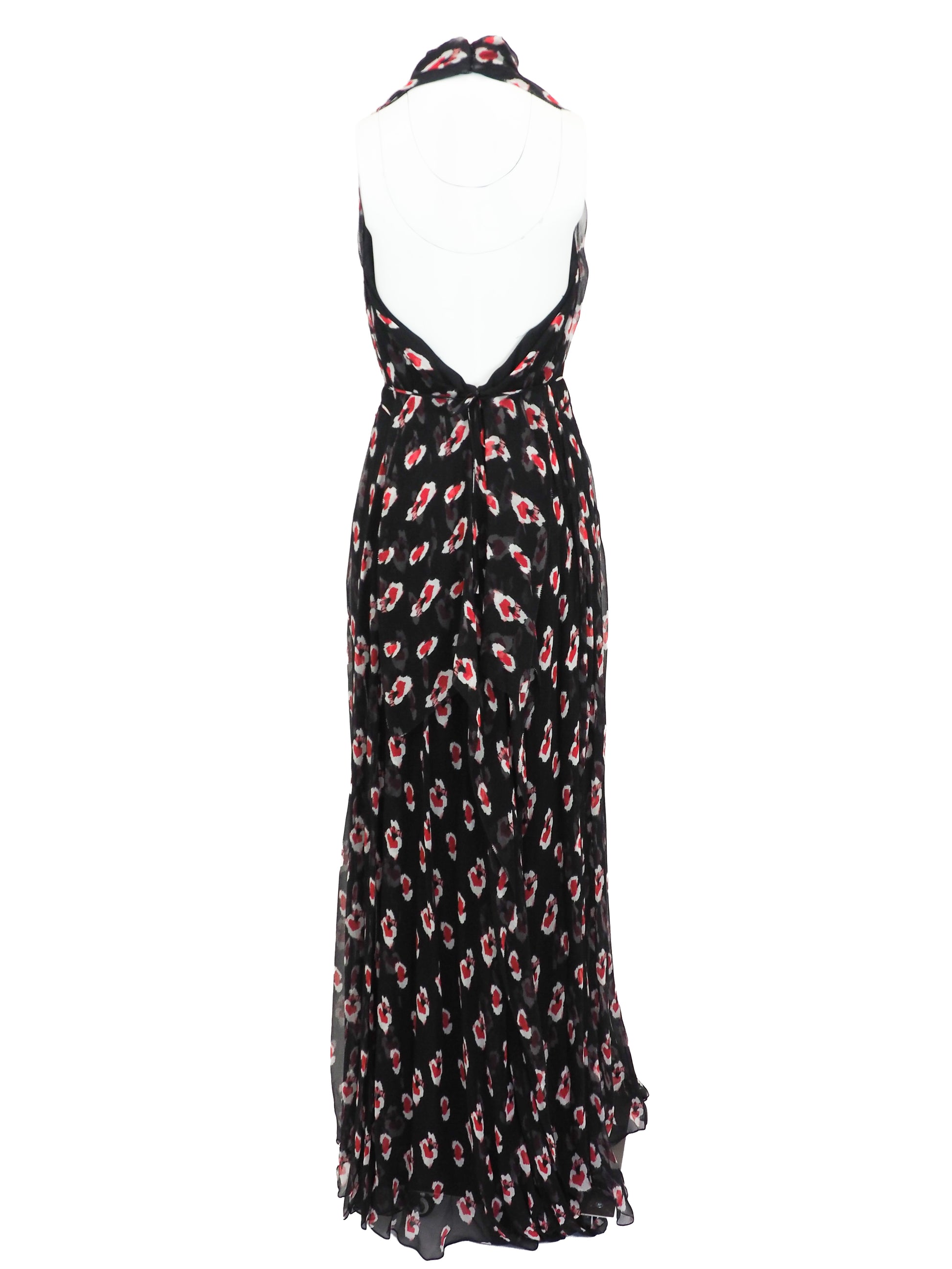 A vintage Carolina Herrera chiffon sleeveless black maxi dress with a red and pink floral print, featuring a halter-style neckline and a tie-waist detail, shown against a plain white background.