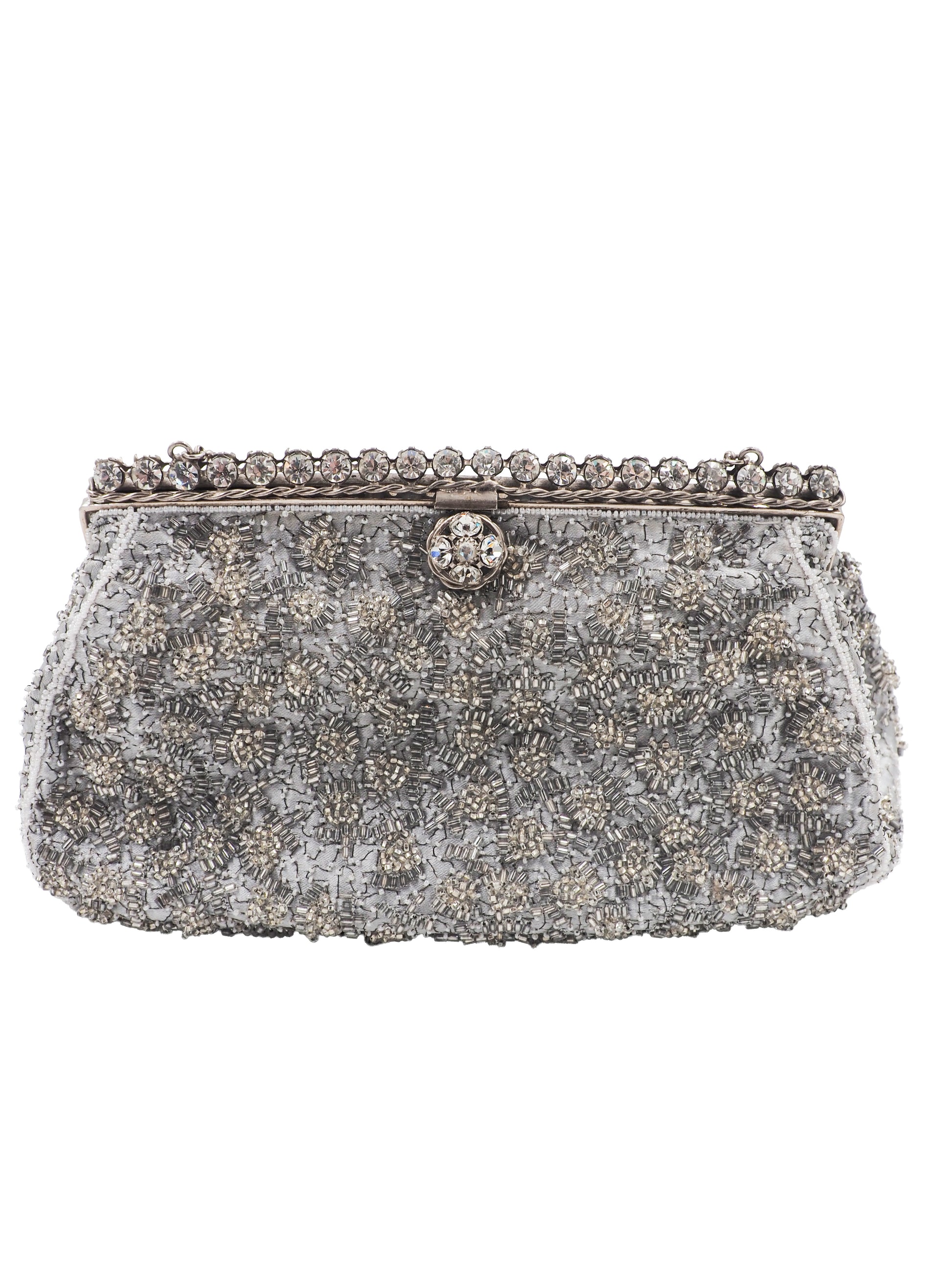 A vintage Elizabeth Arden silver-gray beaded evening clutch bag with a chain strap and a decorative crystal-embellished clasp