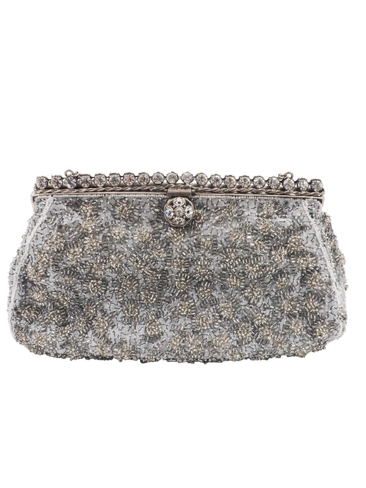 A vintage Elizabeth Arden silver-gray beaded evening clutch bag with a chain strap and a decorative crystal-embellished clasp