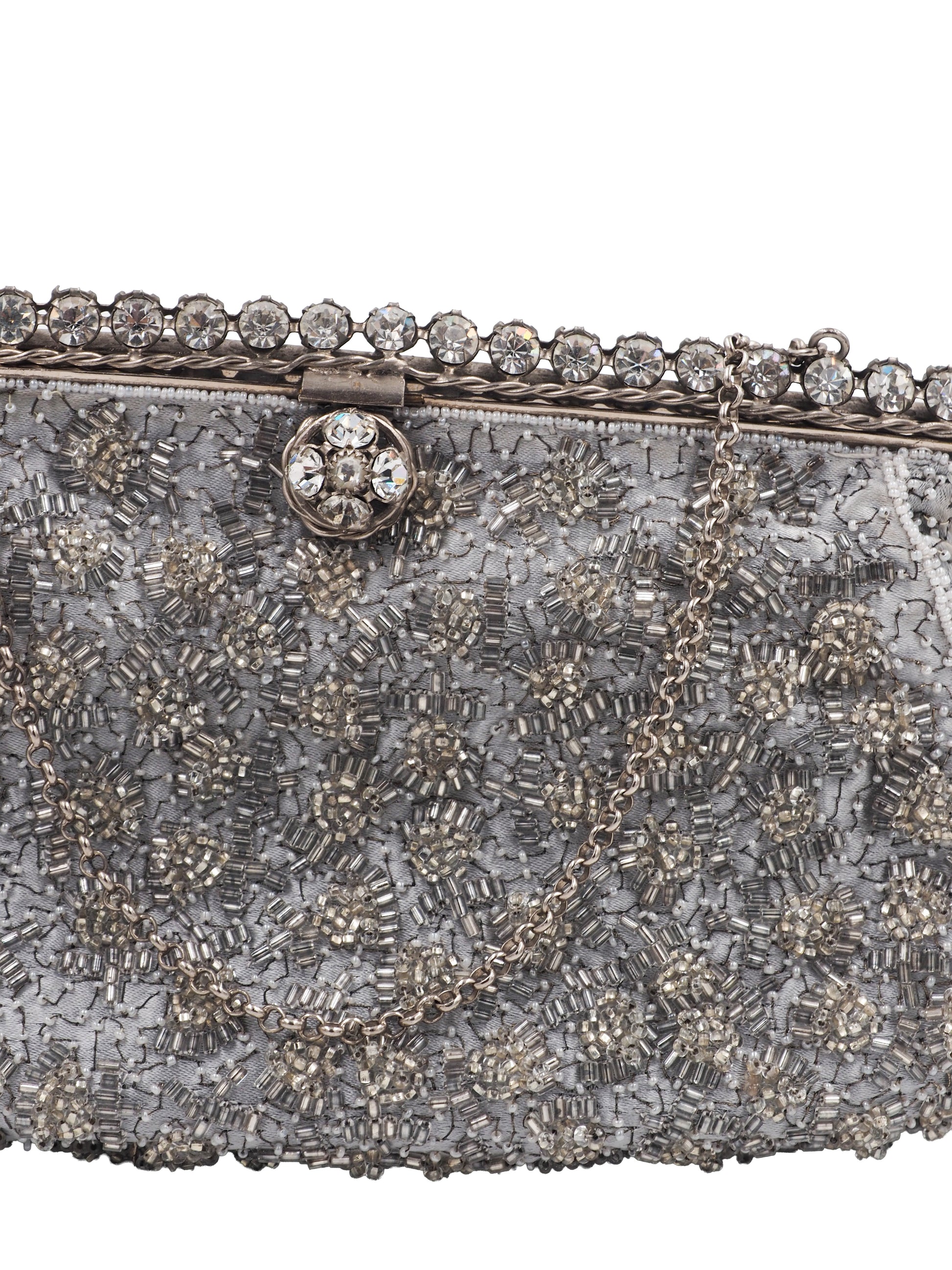 A vintage Elizabeth Arden silver-gray beaded evening clutch bag with a chain strap and a decorative crystal-embellished clasp