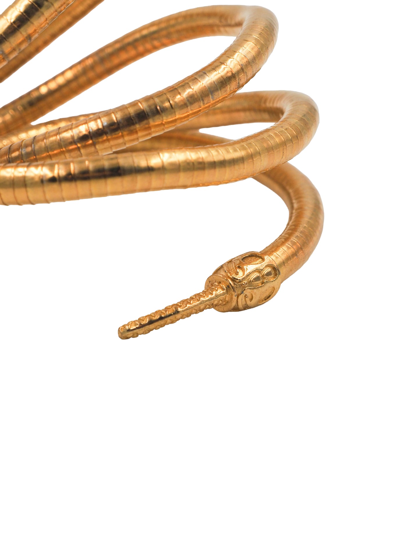 A vintage gold snake wrap bracelet with detailed scales and small black eyes