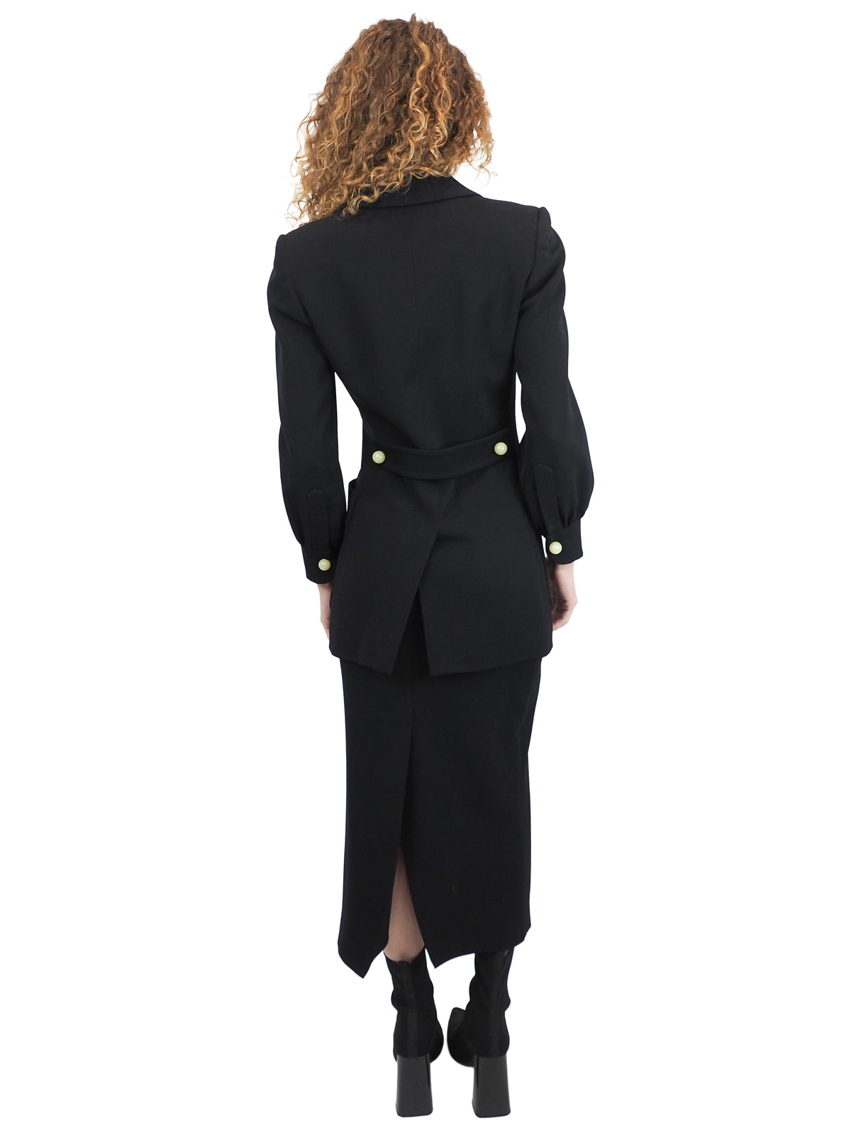 A vintage moschino black two-piece suit with marble buttons on the blazer and a long pencil skirt