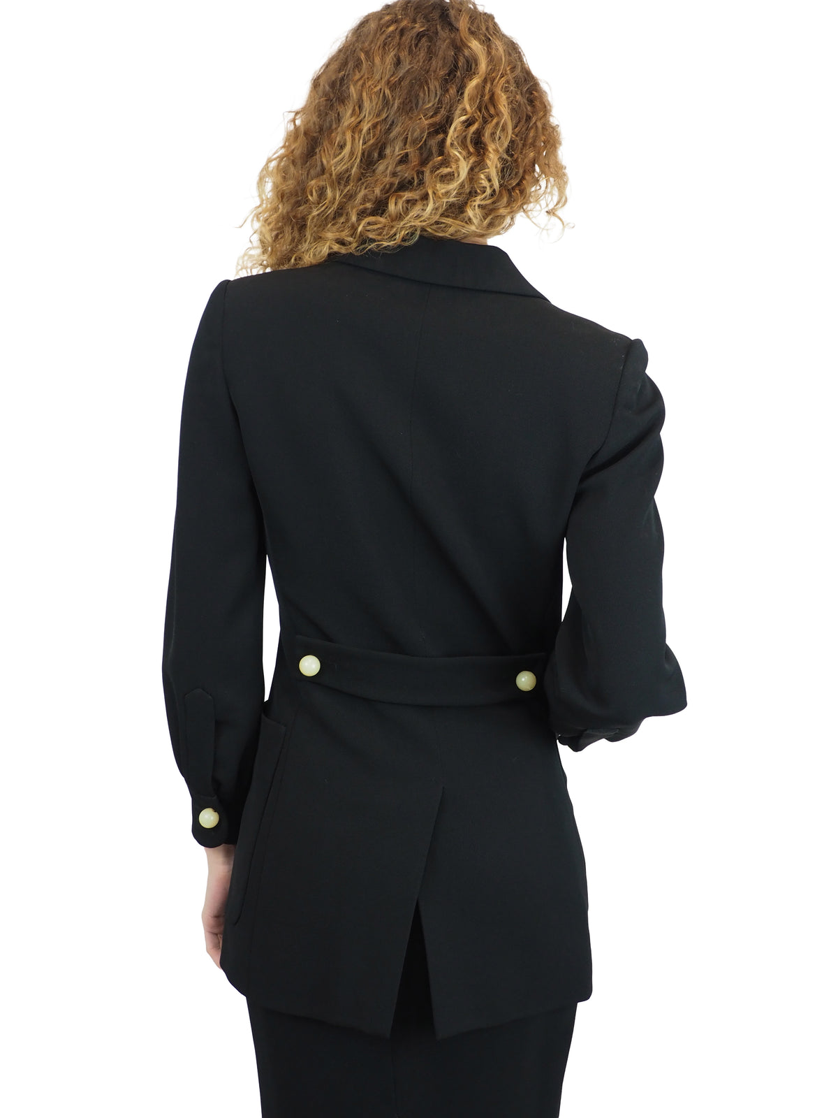 A vintage moschino black two-piece suit with marble buttons on the blazer and a long pencil skirt