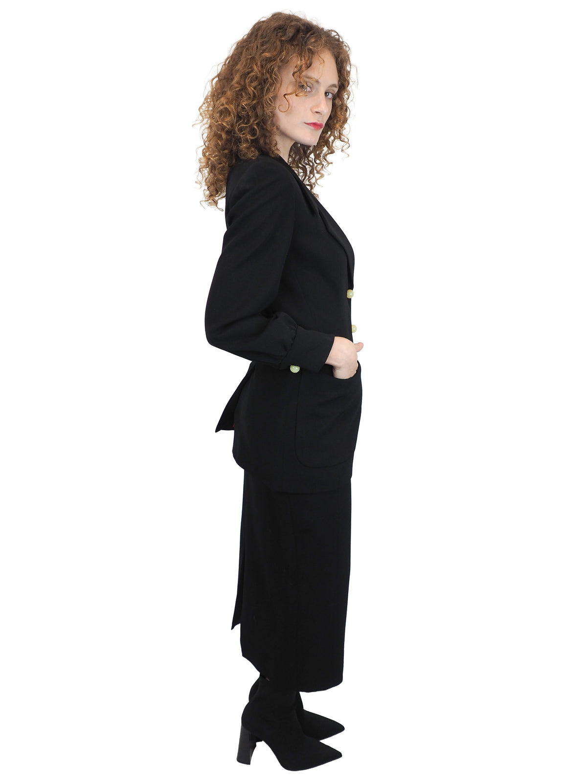 A vintage moschino black two-piece suit with marble buttons on the blazer and a long pencil skirt
