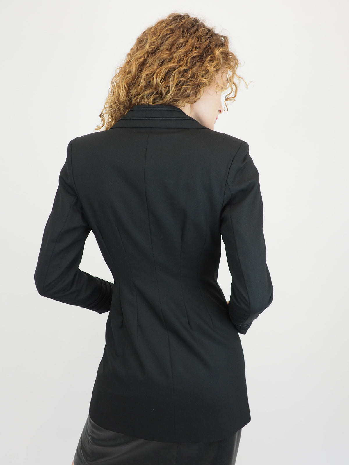 A vintage Richard Tyler black double-breasted blazer with a wrap-style front and notched lapels