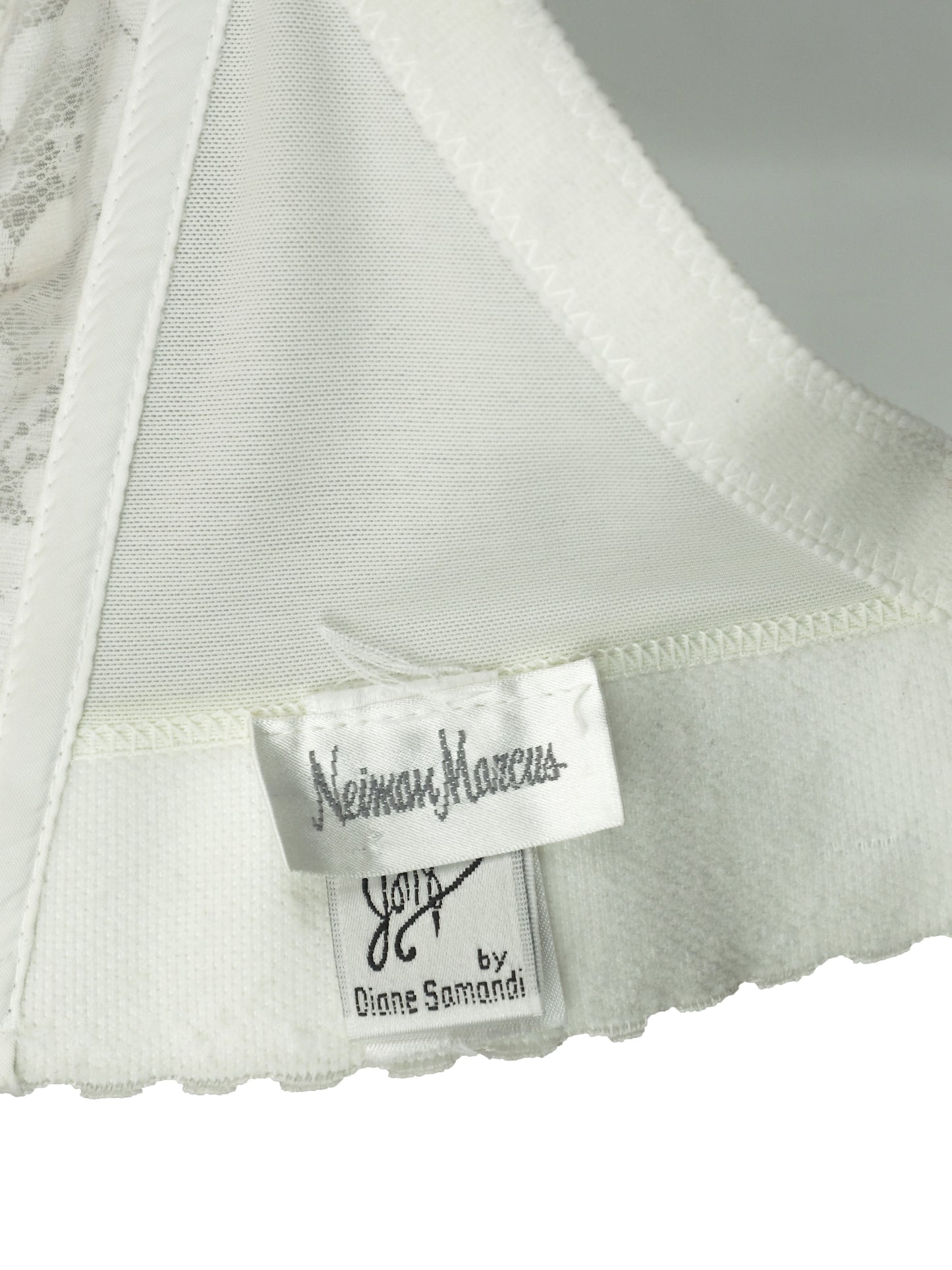 A vintage bridal intricate white lace and tulle corset-style top with floral embroidery, sequins, and bead embellishments by Neiman Marcus