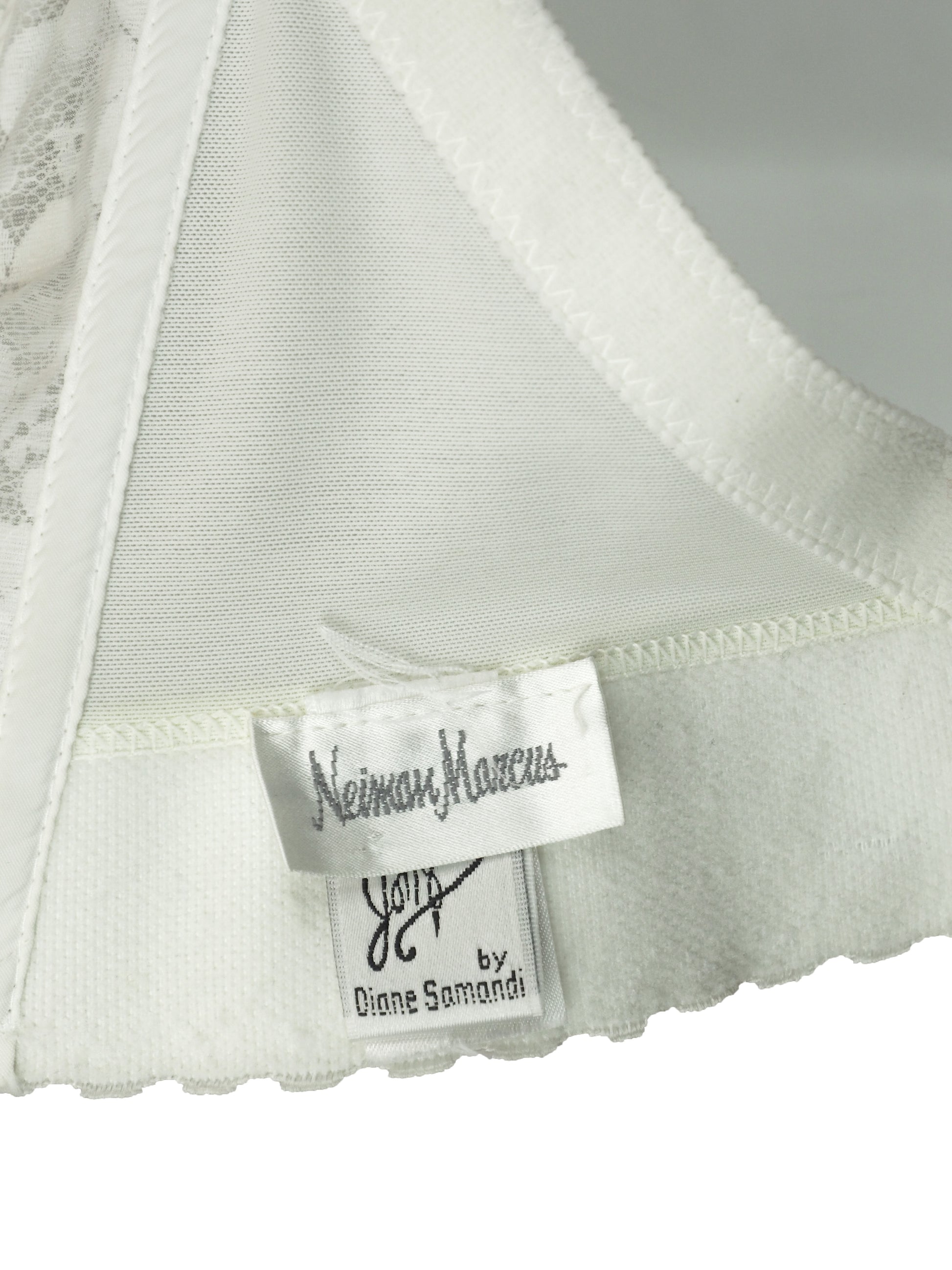 A vintage bridal intricate white lace and tulle corset-style top with floral embroidery, sequins, and bead embellishments by Neiman Marcus