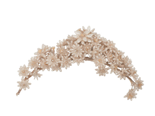 A vintage wedding delicate floral headband featuring small cream-colored faux flowers and branches
