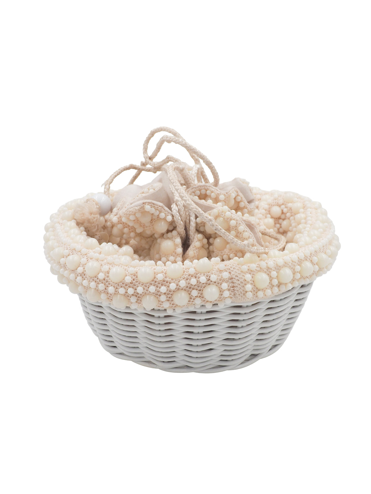 A cream-colored beaded bucket bag with a textured pom-pom pattern, featuring a drawstring closure and a light white woven basket base