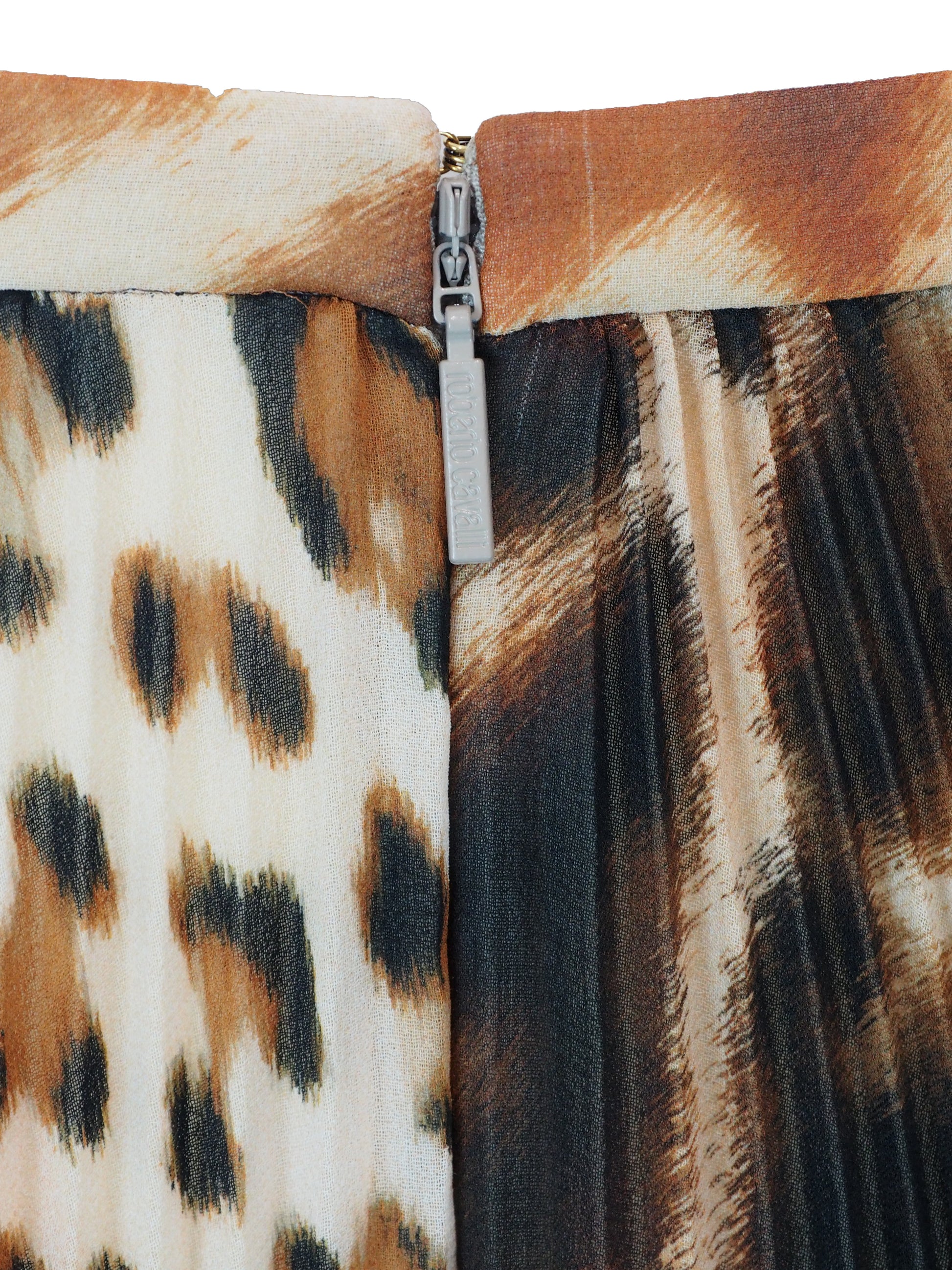 A vintage Roberto cavalli 2021 pleated midi skirt featuring an abstract leopard print pattern in brown, black, and beige