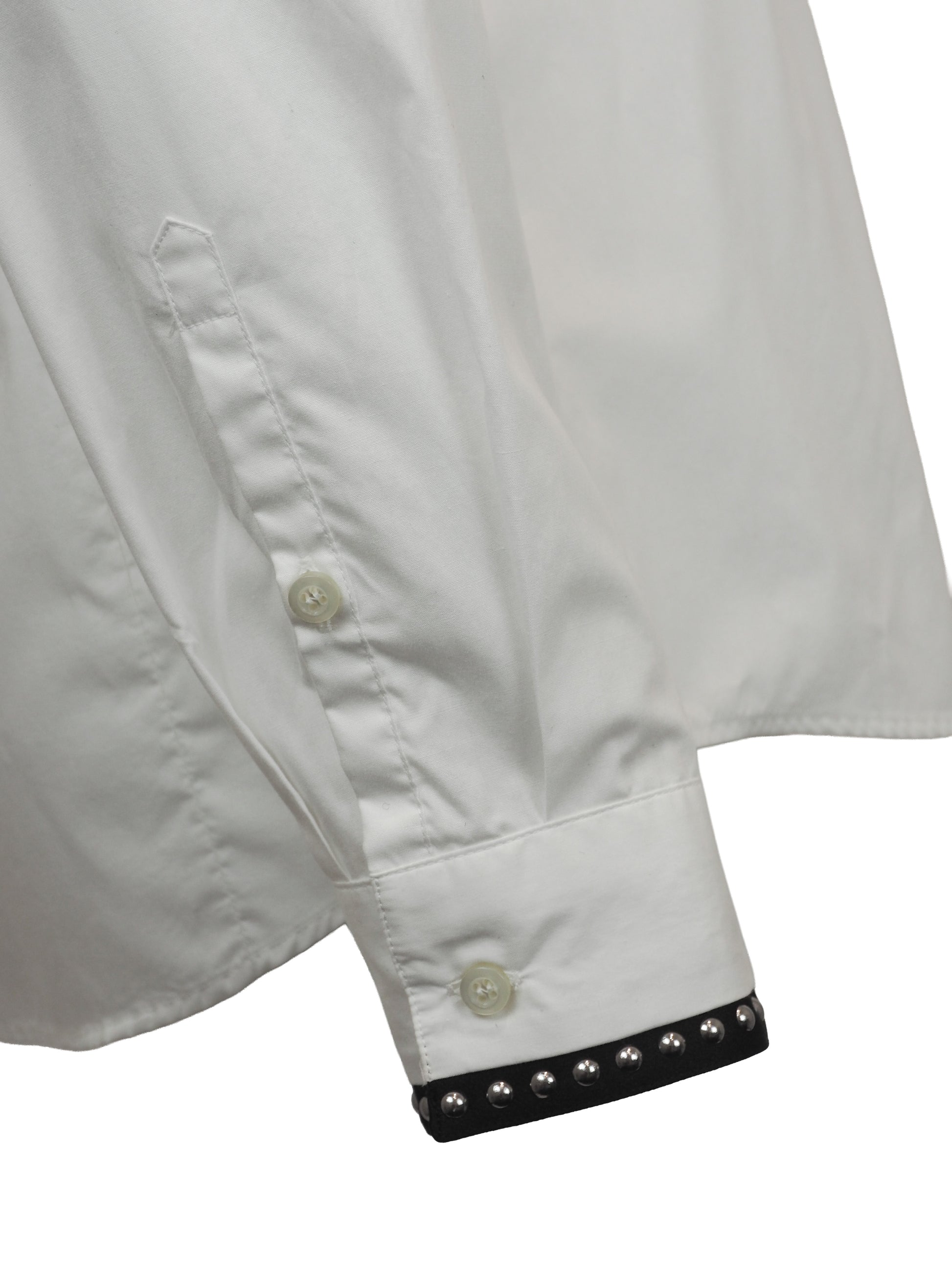 A vintage Roberto cavalli white long-sleeve button-down shirt with black and silver patterned stud trim on the collar and cuffs