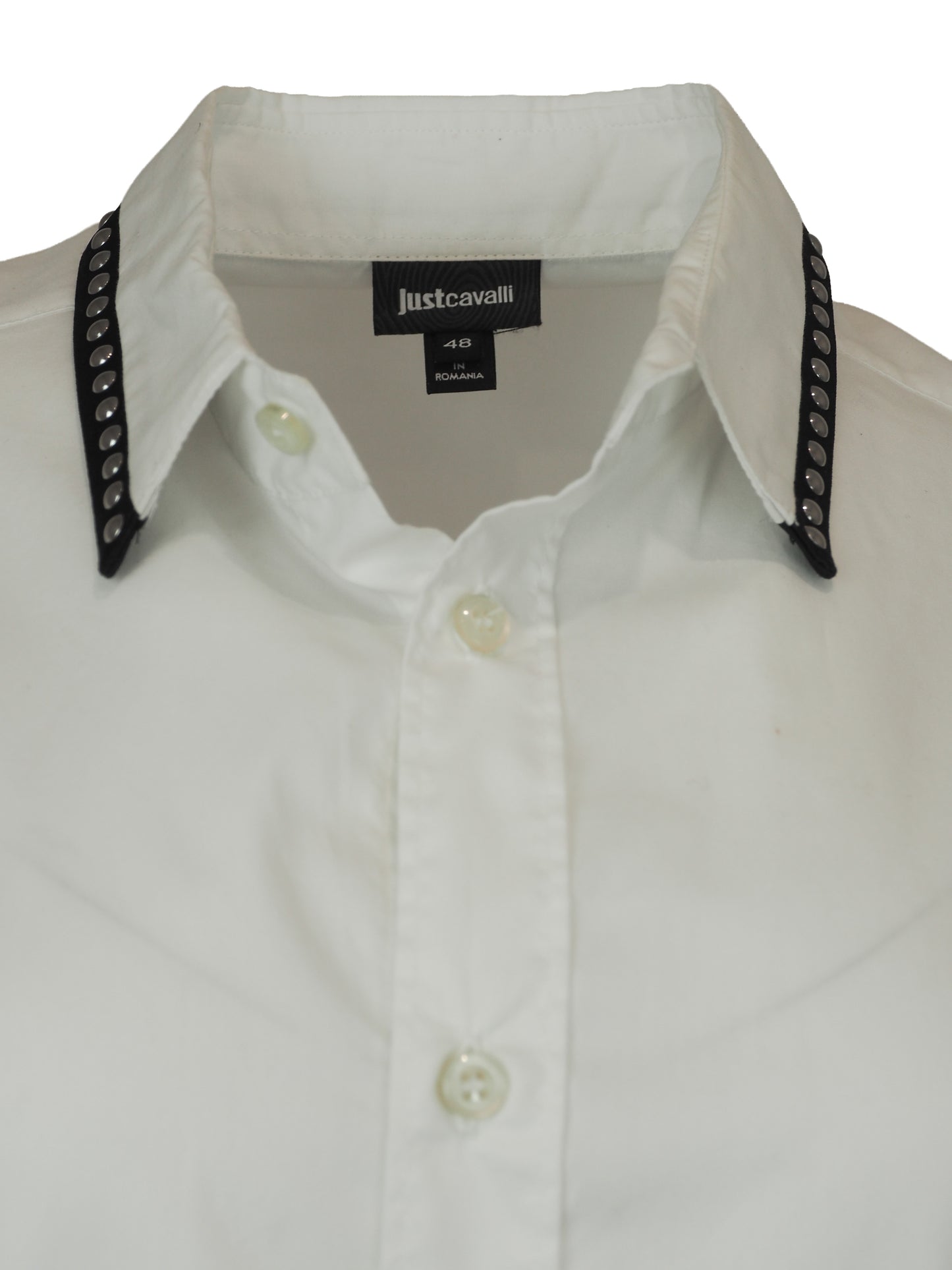 A vintage Roberto cavalli white long-sleeve button-down shirt with black and silver patterned stud trim on the collar and cuffs