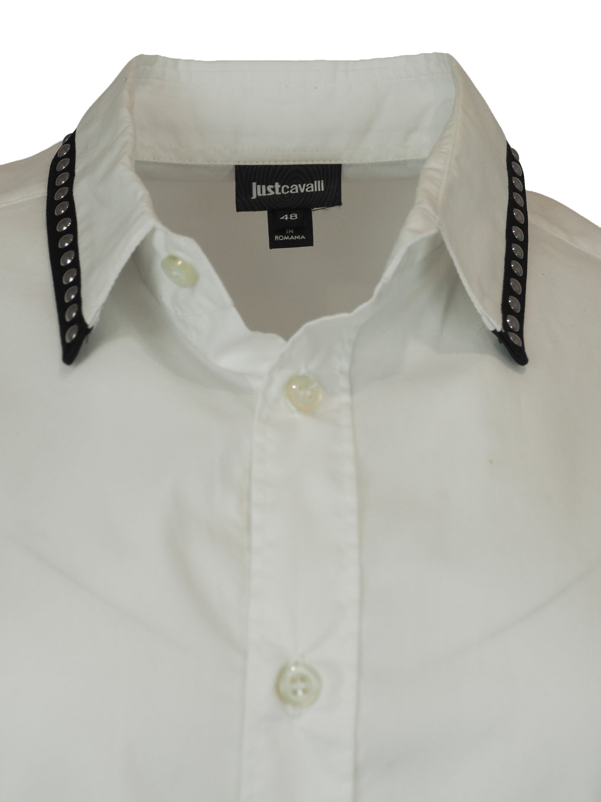 A vintage Roberto cavalli white long-sleeve button-down shirt with black and silver patterned stud trim on the collar and cuffs