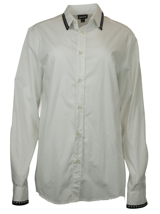 A vintage Roberto cavalli white long-sleeve button-down shirt with black and silver patterned stud trim on the collar and cuffs
