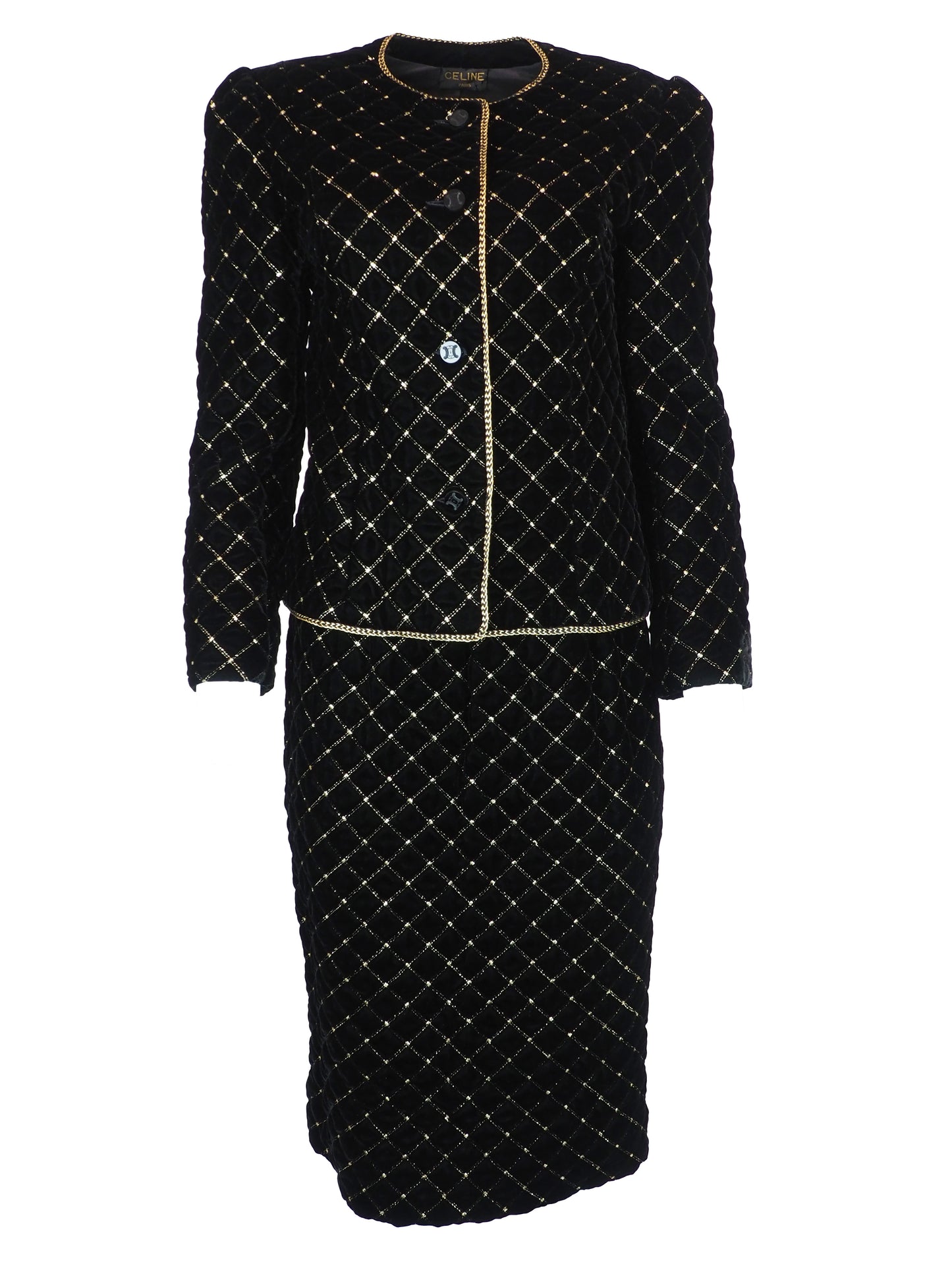 A vintage Celine black velvet two-piece suit set consisting of a cropped jacket and a matching pencil skirt, both decorated with a gold diamond lattice pattern and gold trim