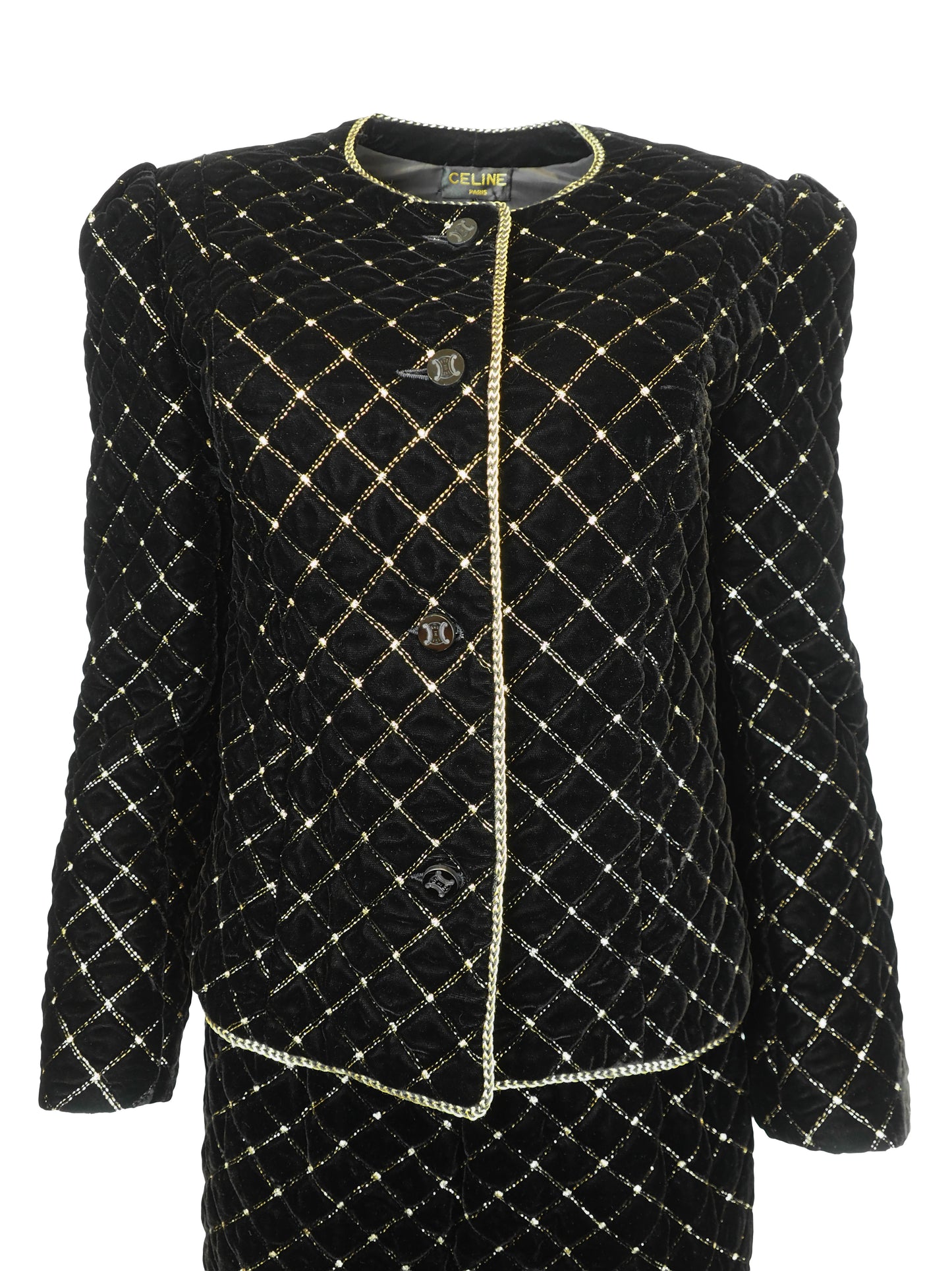 A vintage Celine black velvet two-piece suit set consisting of a cropped jacket and a matching pencil skirt, both decorated with a gold diamond lattice pattern and gold trim