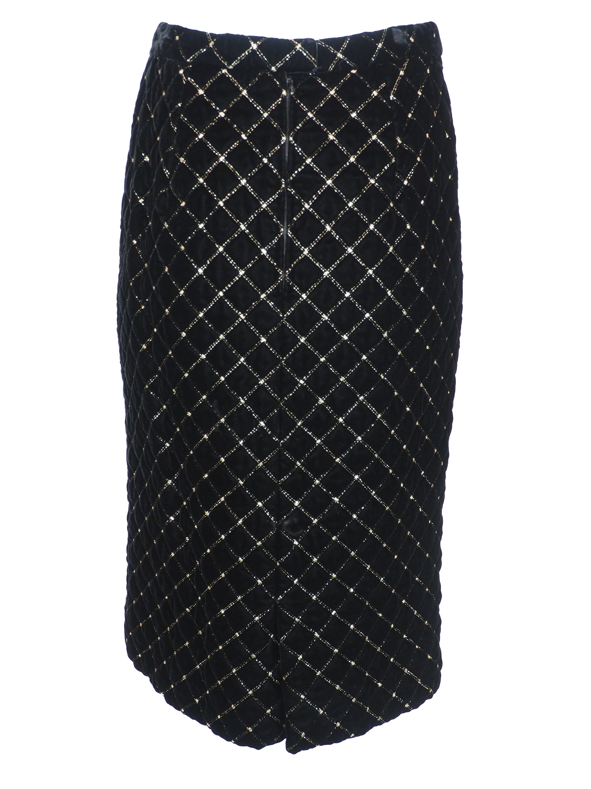 A vintage Celine black velvet two-piece suit set consisting of a cropped jacket and a matching pencil skirt, both decorated with a gold diamond lattice pattern and gold trim