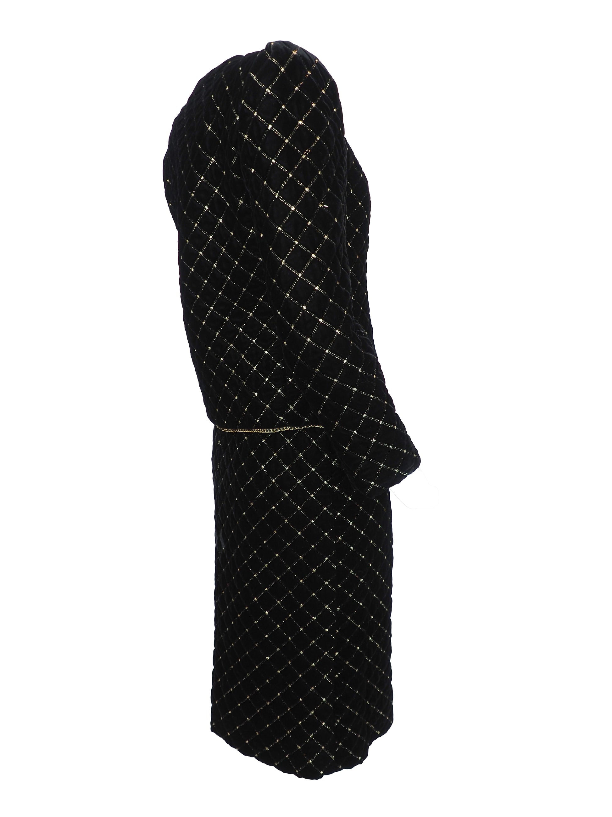 A vintage Celine black velvet two-piece suit set consisting of a cropped jacket and a matching pencil skirt, both decorated with a gold diamond lattice pattern and gold trim