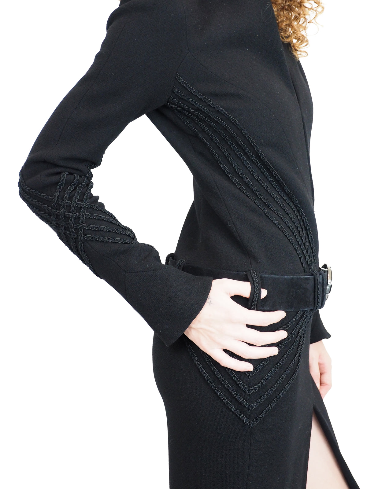A vintage 2009 Chanel black long-sleeve wool dress with a plunging V-neckline, a matching black belt with a round silver buckle