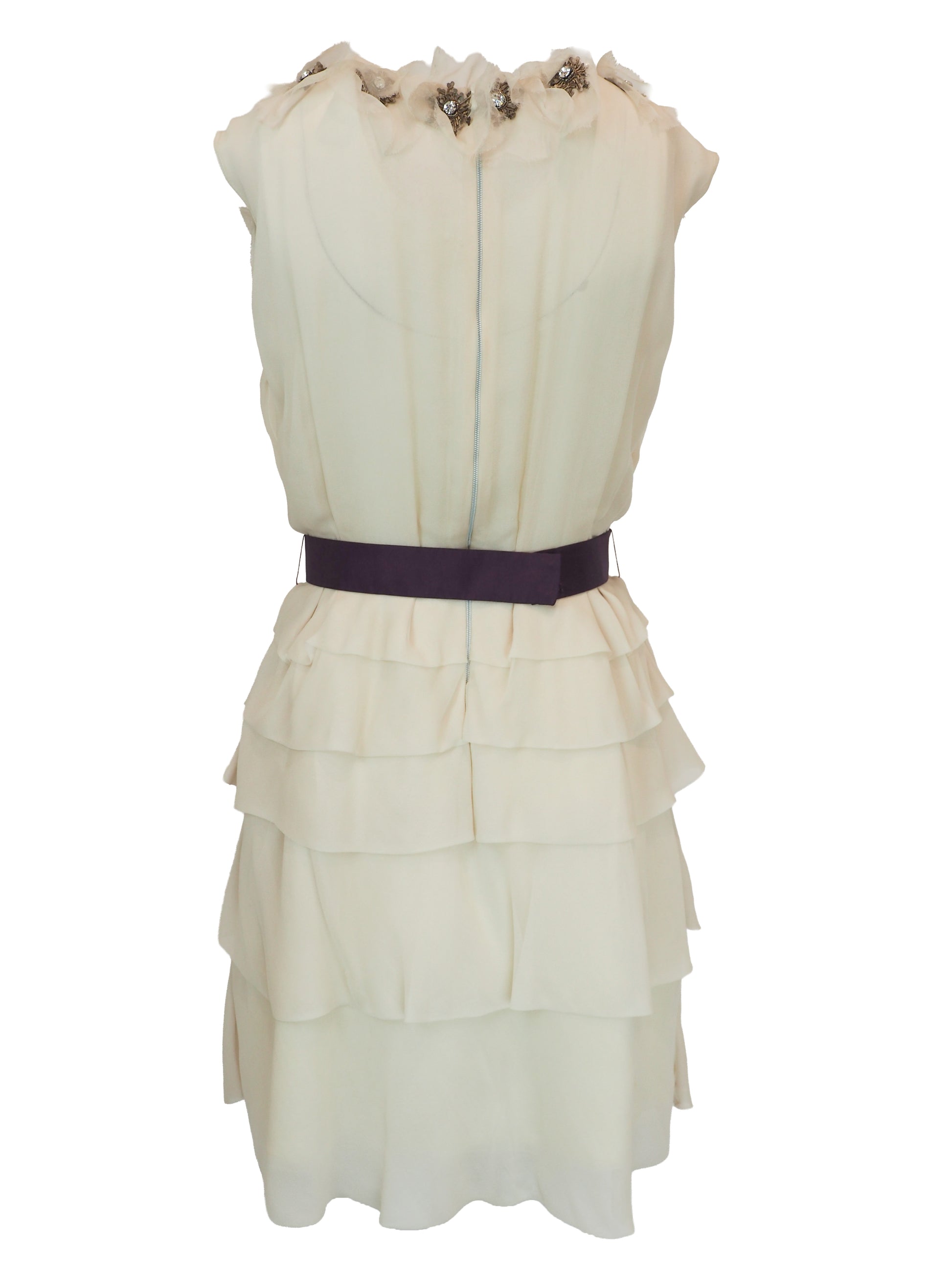 A vintage Chloe Y2K off-white sleeveless ruffled dress with floral embellishments on the bodice and a dark purple waist belt 