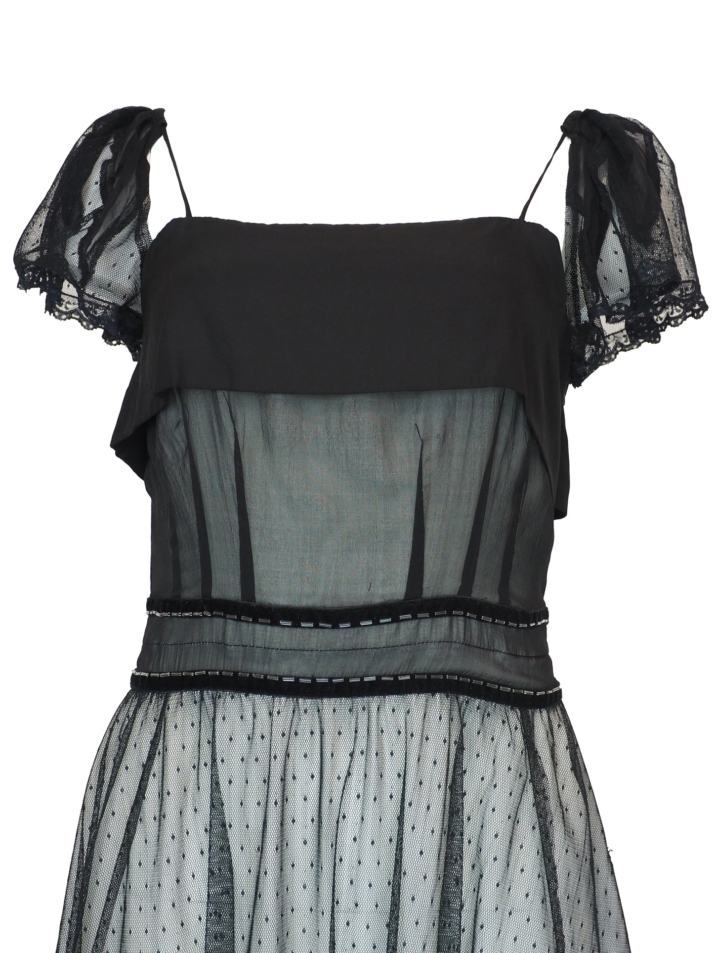 A vintage Chloe 2005 black sheer mesh dress with a solid black off-the-shoulder yoke, a polka-dotted tulle skirt, and ruffled trim details