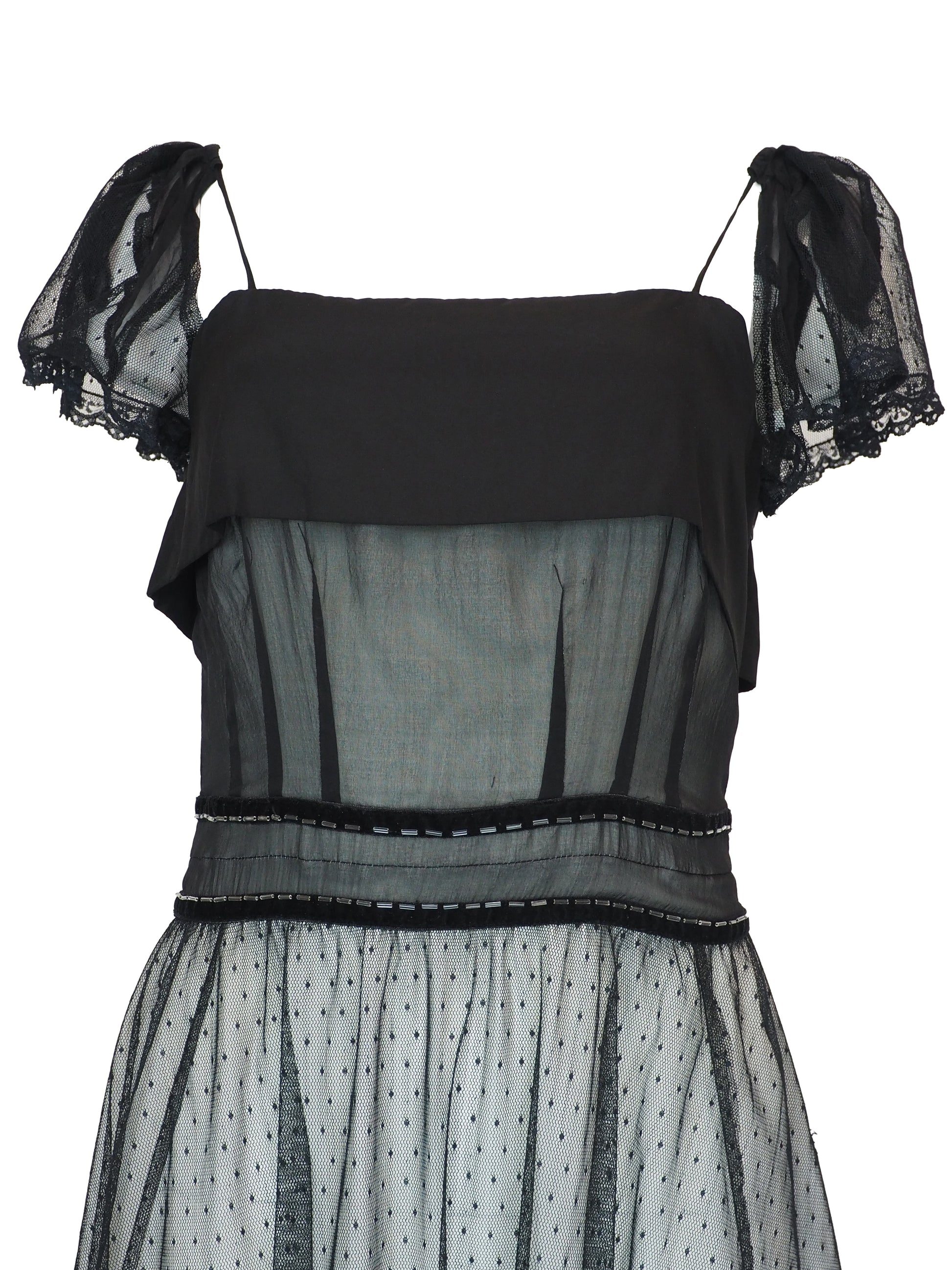 A vintage Chloe 2005 black sheer mesh dress with a solid black off-the-shoulder yoke, a polka-dotted tulle skirt, and ruffled trim details