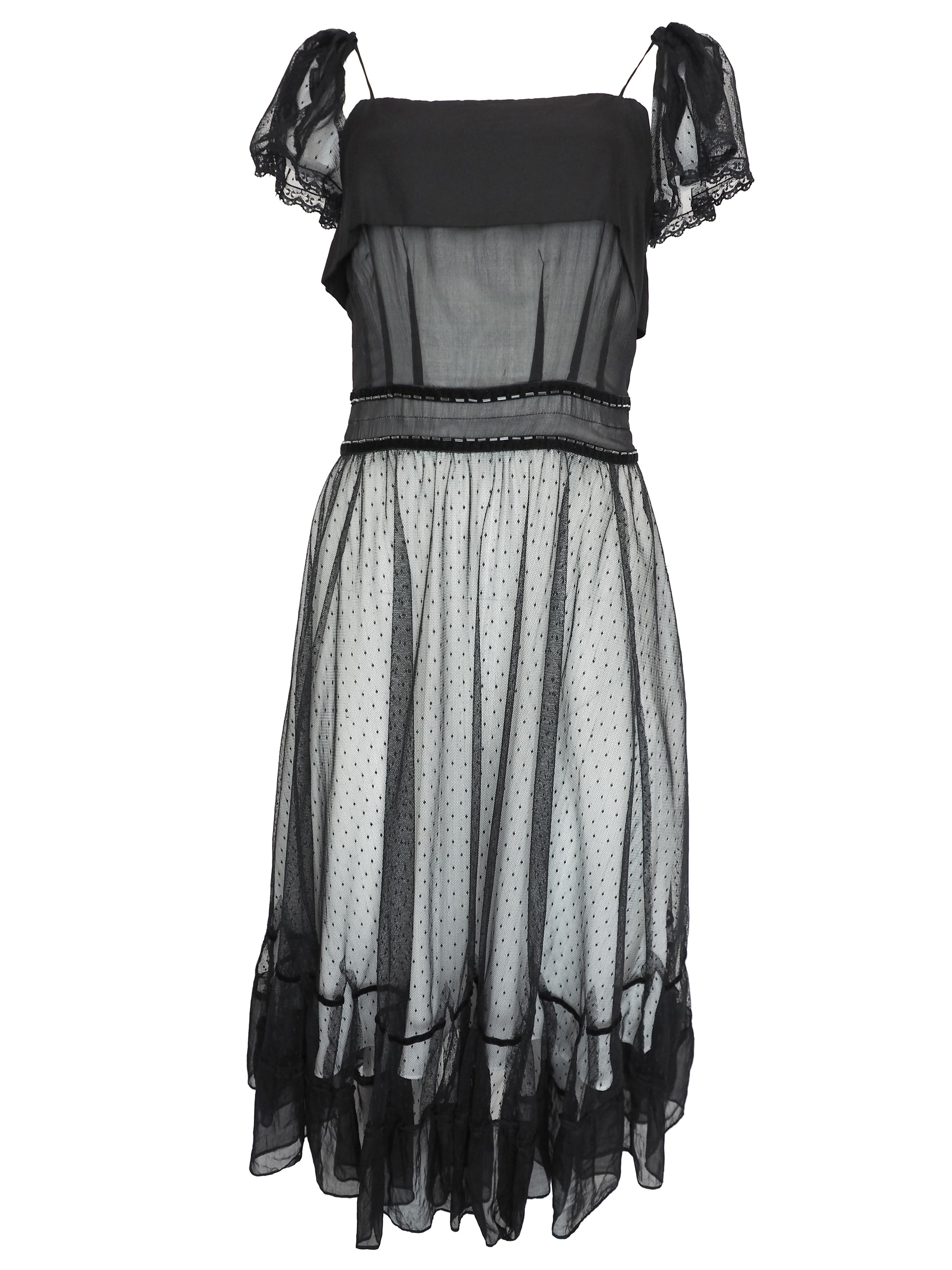 A vintage Chloe 2005 black sheer mesh dress with a solid black off-the-shoulder yoke, a polka-dotted tulle skirt, and ruffled trim details
