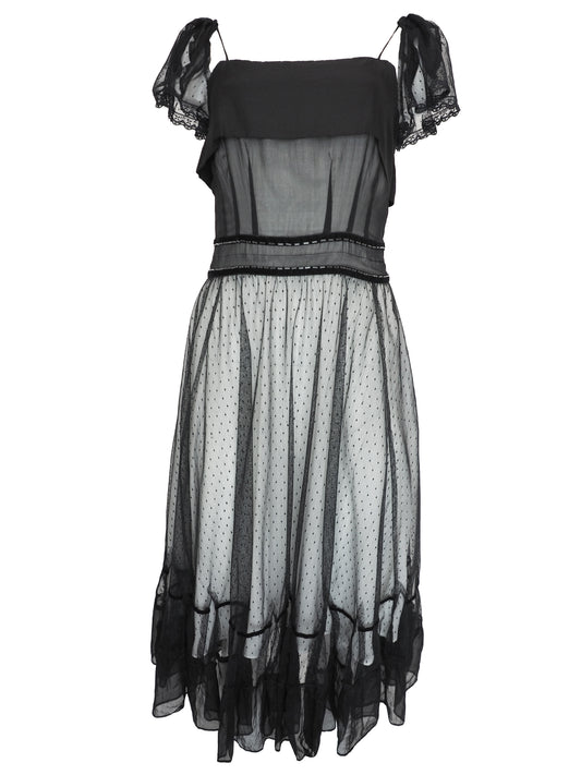 A vintage Chloe 2005 black sheer mesh dress with a solid black off-the-shoulder yoke, a polka-dotted tulle skirt, and ruffled trim details
