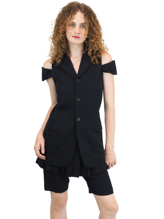 A vintage comme des garçons cold-shoulder blazer with matching navy shorts