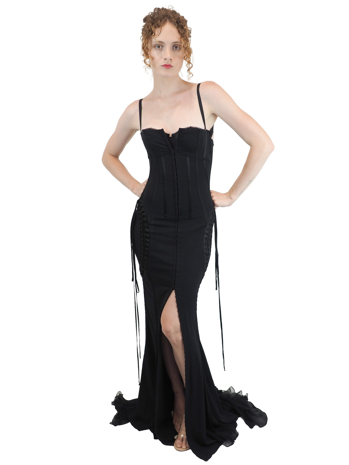 A vintage 2003 dolce and Gabbana long black spaghetti-strap dress with a corset-style bodice, side lace-up details, and a high front slit