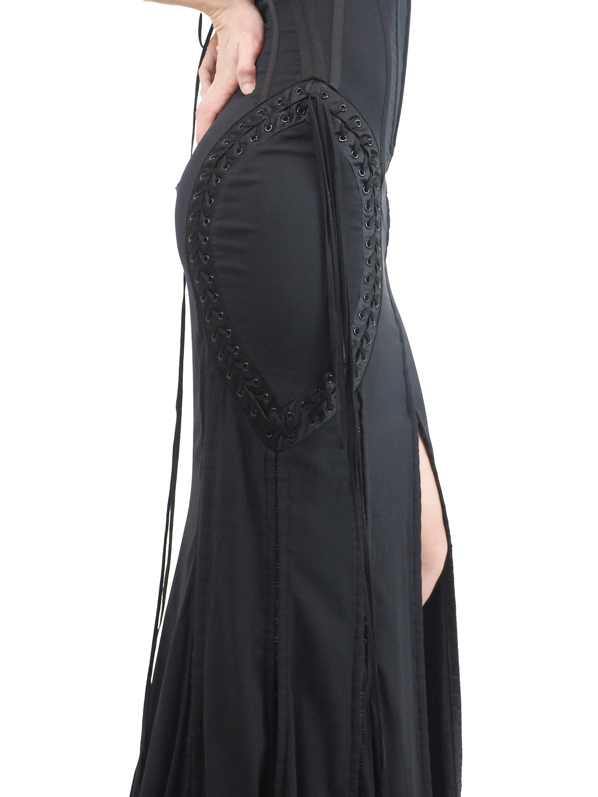 A vintage 2003 dolce and Gabbana long black spaghetti-strap dress with a corset-style bodice, side lace-up details, and a high front slit