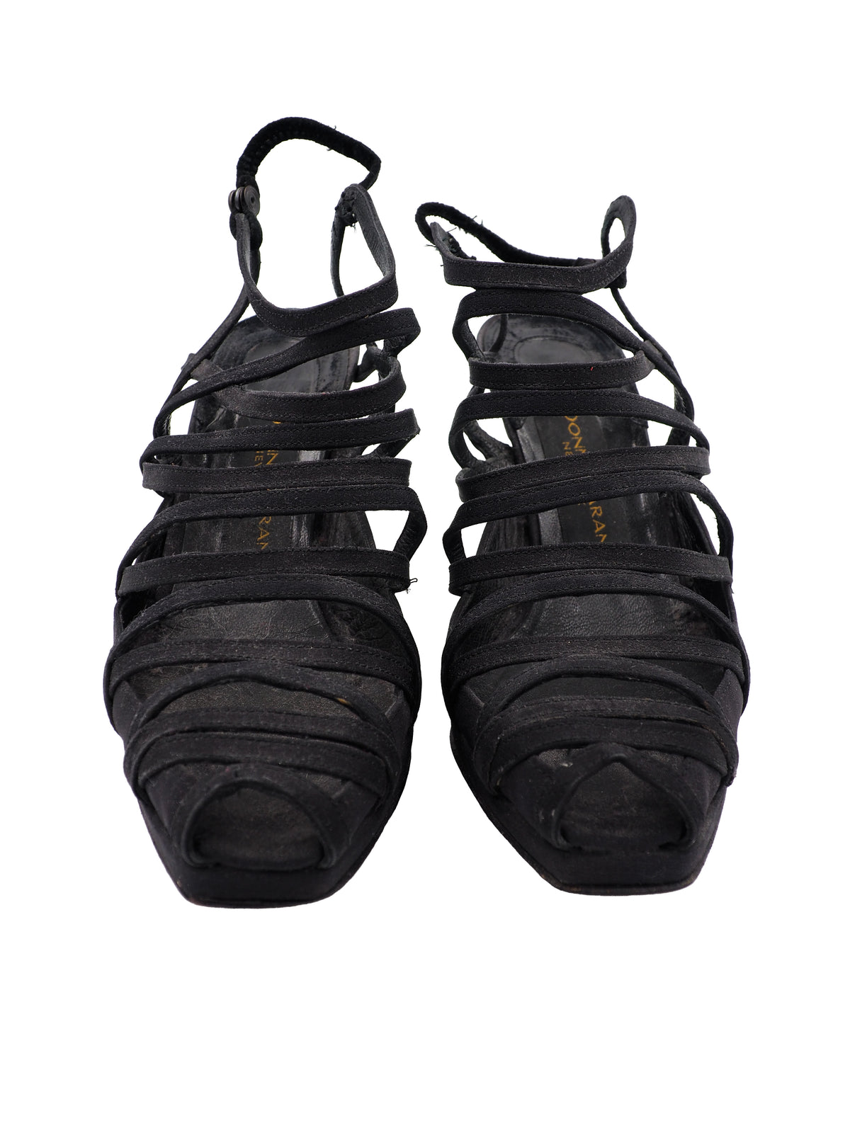 A pair of vintage donna Karan black strappy slingback high-heeled sandals with a low block heel and cutout toe