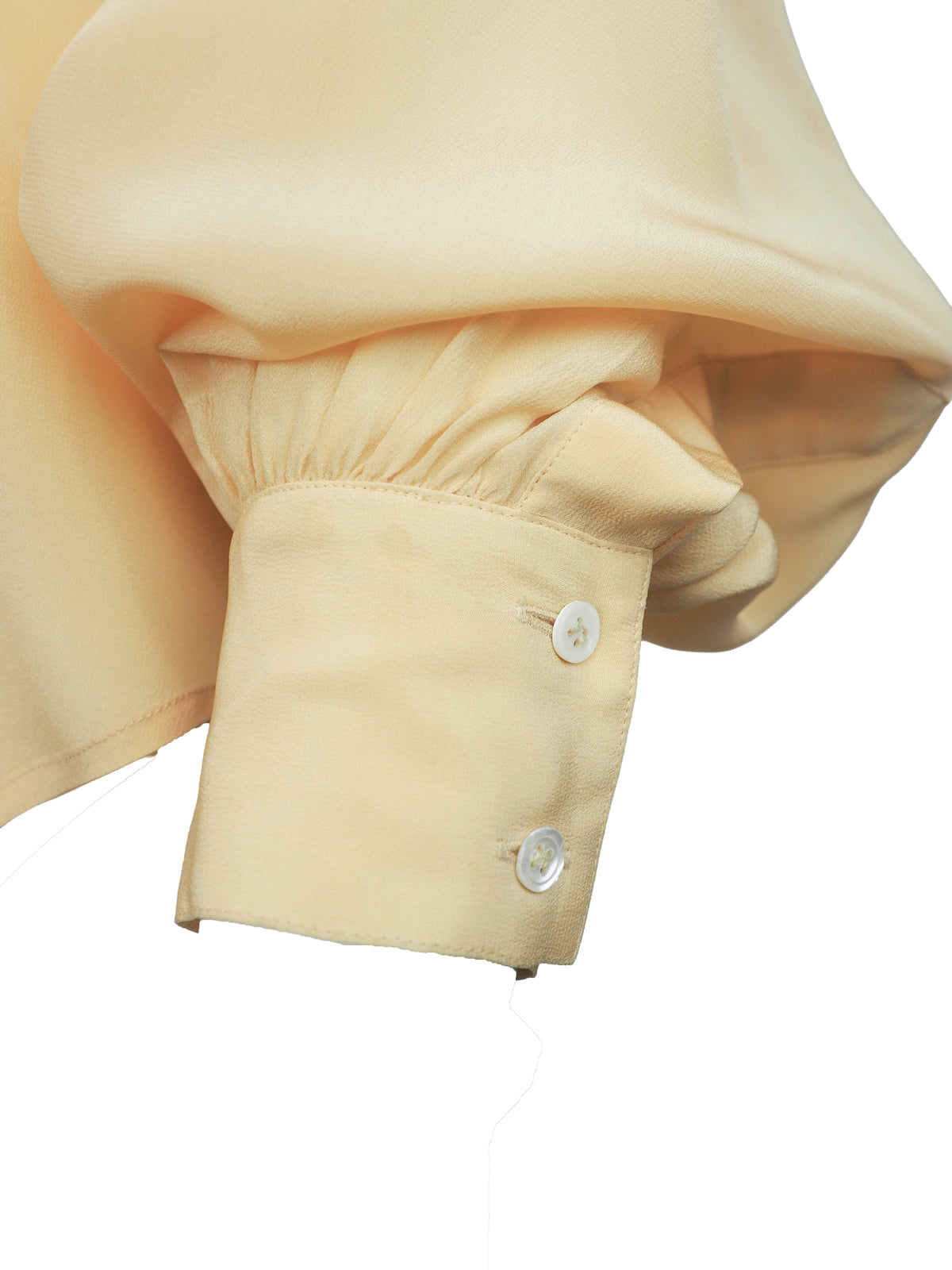 A vintage 1980s Ellen tracy pale yellow long-sleeve blouse with a pointed collar and voluminous balloon sleeves
