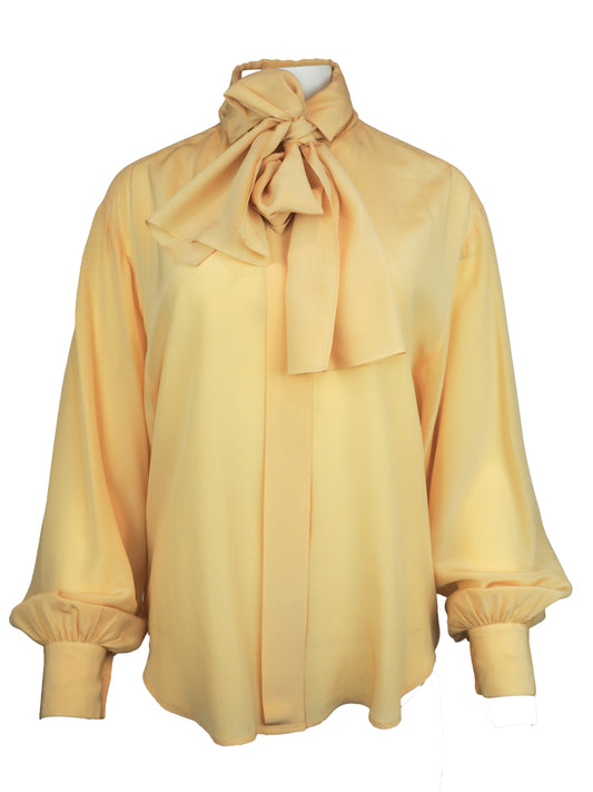 A vintage 1980s Ellen tracy pale yellow long-sleeve blouse with a pointed collar and voluminous balloon sleeves