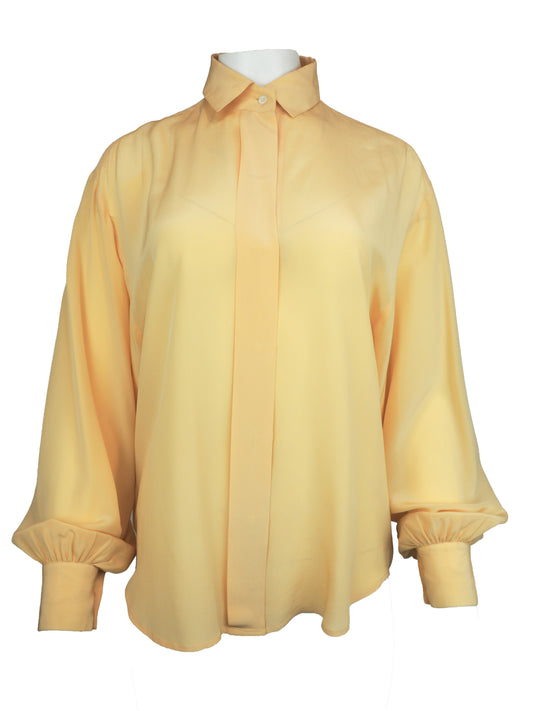 A vintage 1980s Ellen tracy pale yellow long-sleeve blouse with a pointed collar and voluminous balloon sleeves