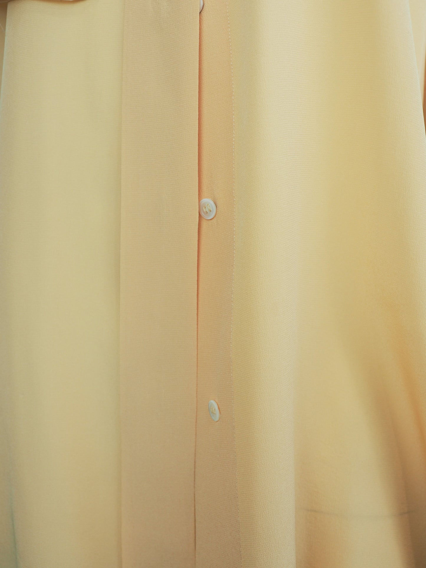 A vintage 1980s Ellen tracy pale yellow long-sleeve blouse with a pointed collar and voluminous balloon sleeves