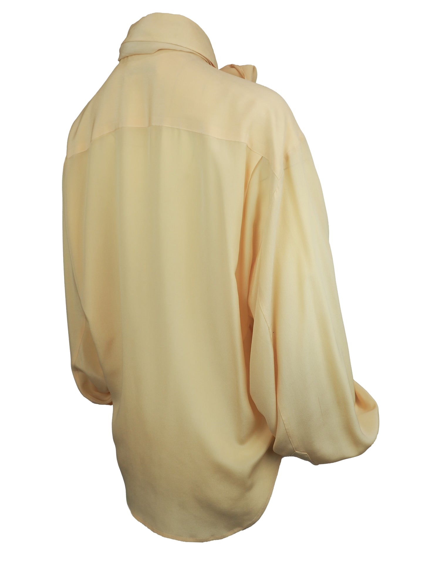 A vintage 1980s Ellen tracy pale yellow long-sleeve blouse with a pointed collar and voluminous balloon sleeves