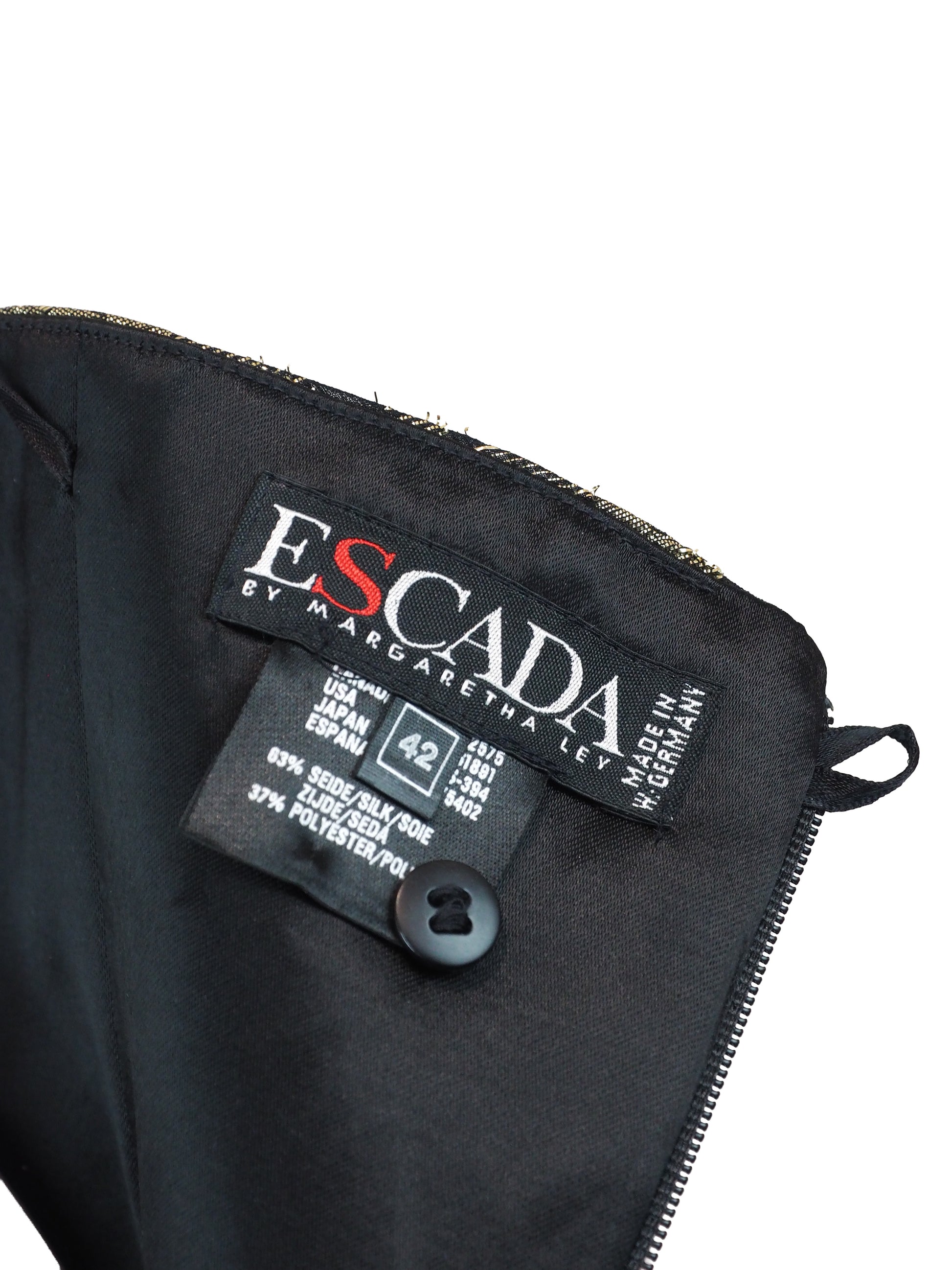 A 80s Escada strapless ruched bustier top featuring a textured metallic gold and black pattern