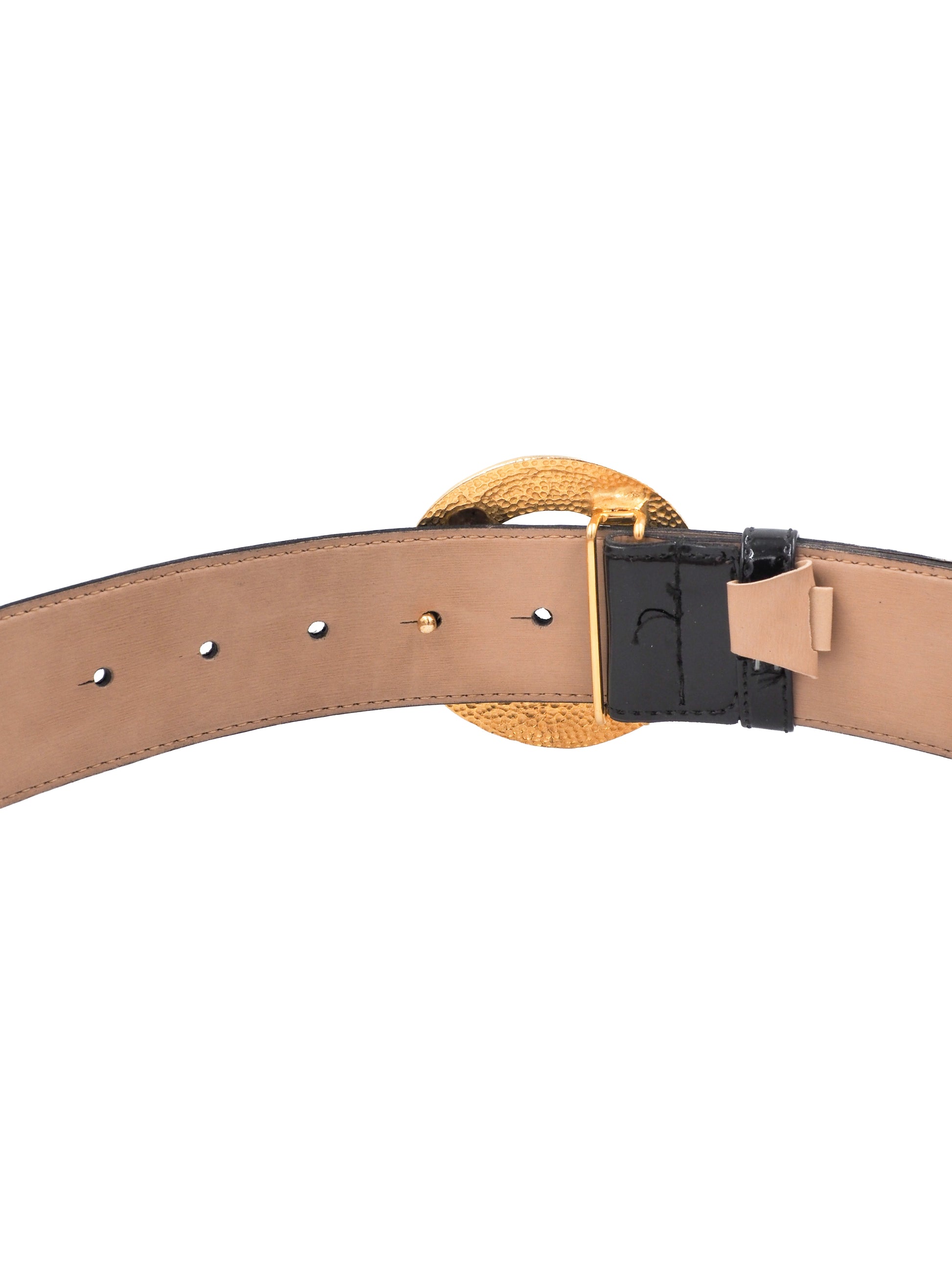 A vintage Gail labelle black leather belt with a large, textured gold buckle featuring a stylized animal motif