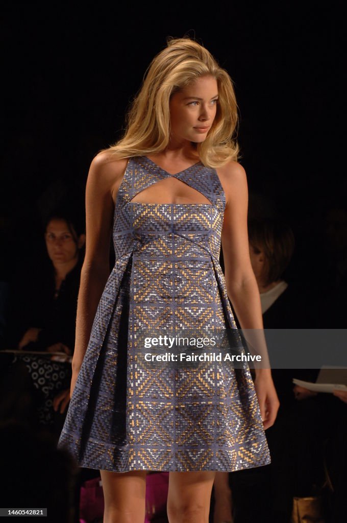 Bill Blass for Neiman Marcus Spring 2007 Mercedes Benz fashion week model wearing a blue metallic patterned dress on a runway