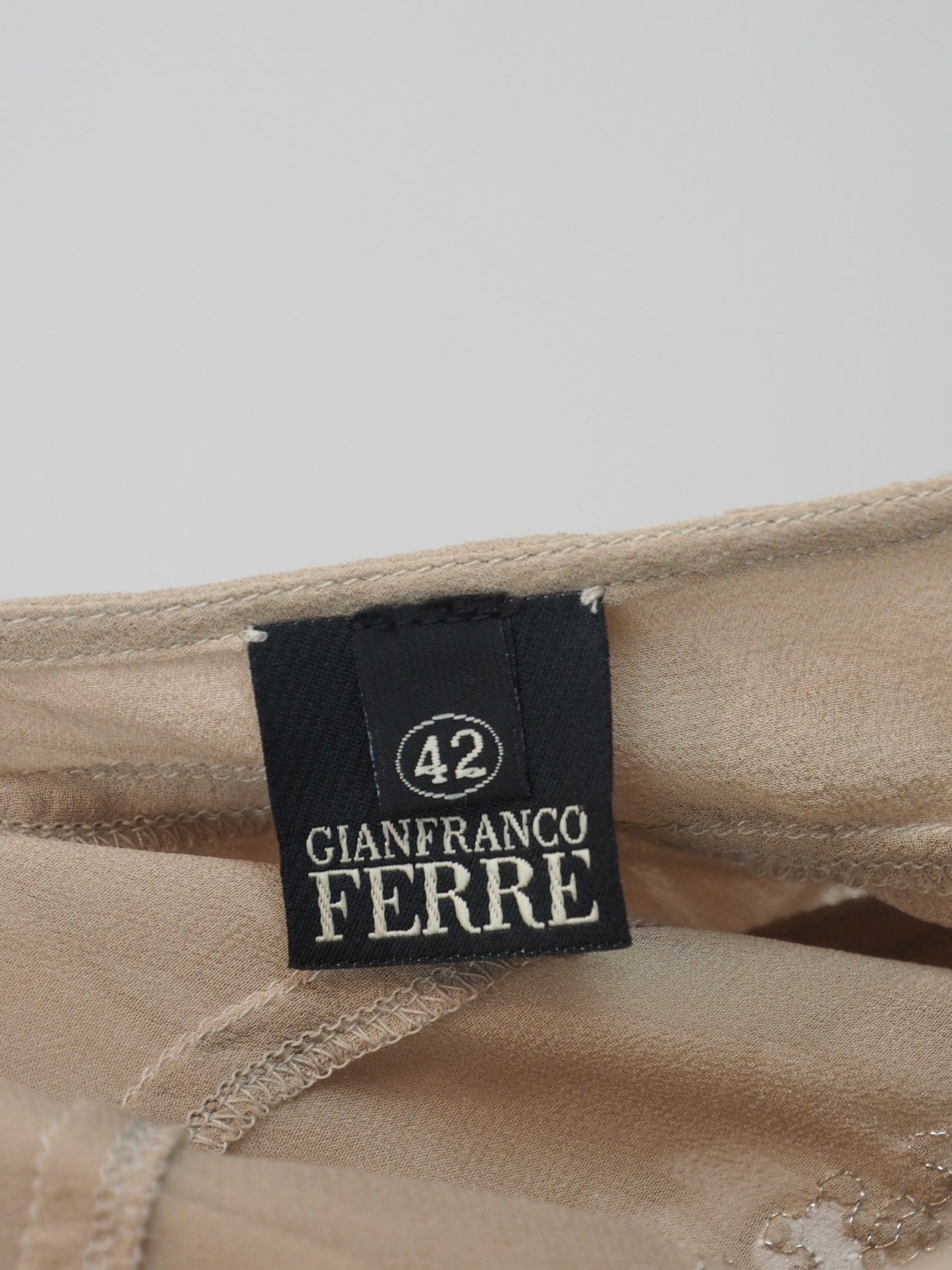 A vintage gianfranco ferre nude pink ruffled spaghetti-strap top with silver sequin trim