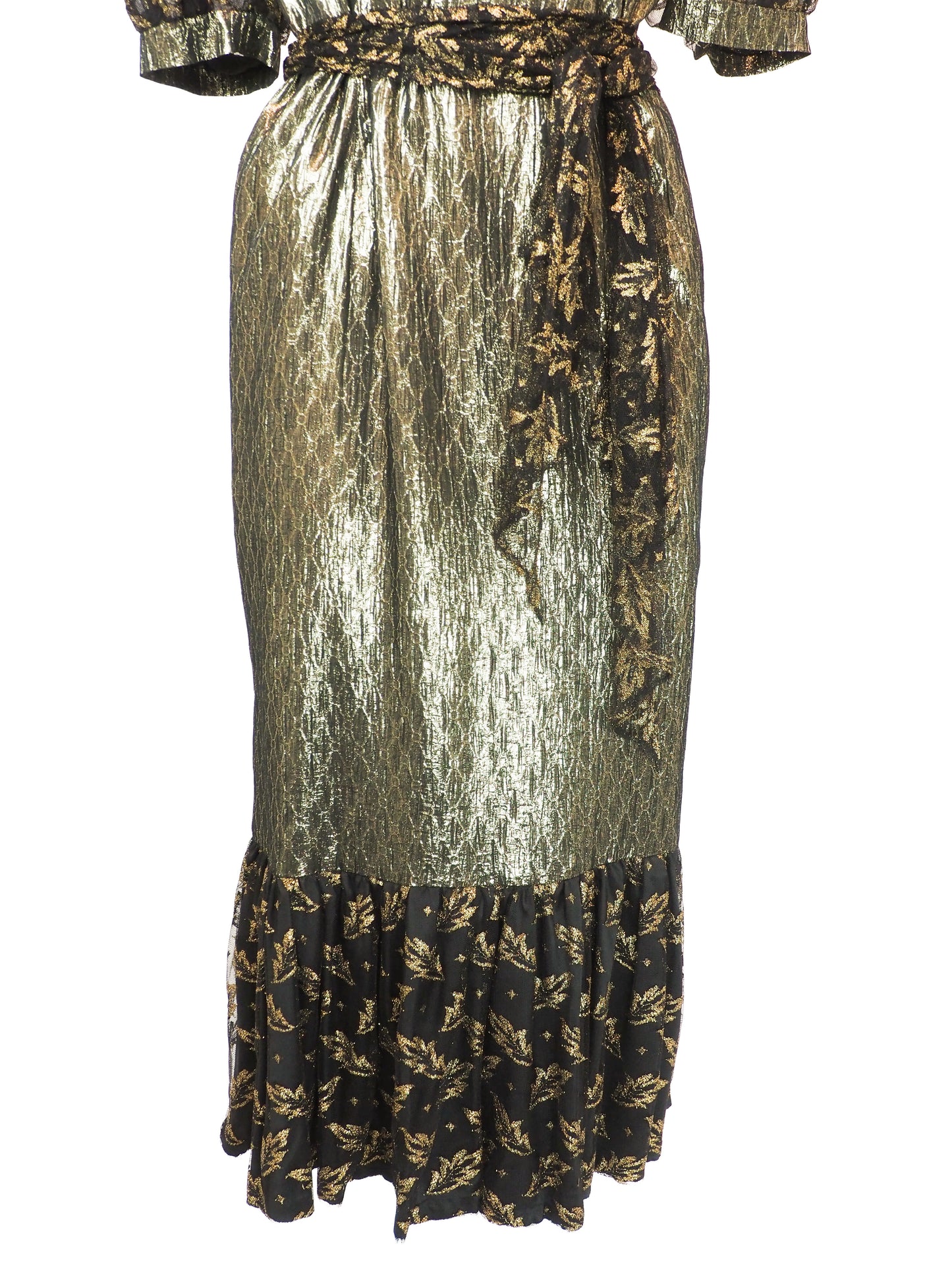 A vintage 1980s metallic gold and black patterned midi dress with puff sleeves, a matching waist tie, and a ruffled hem