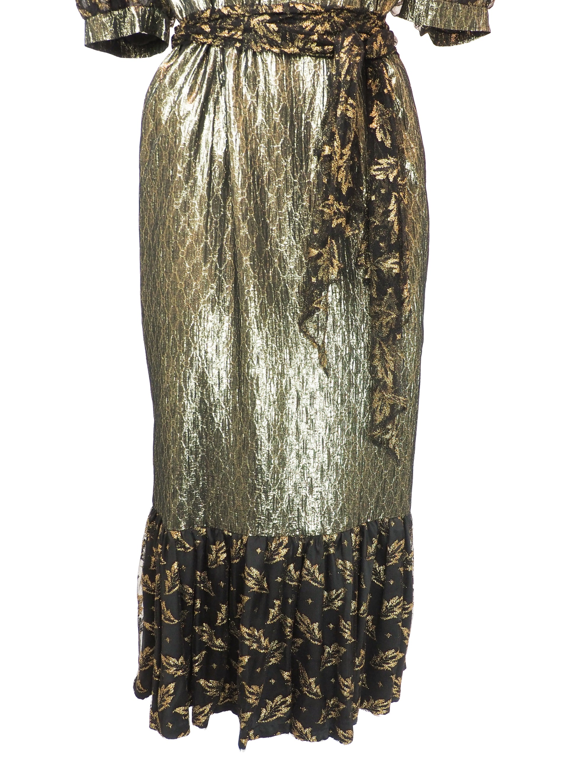 A vintage 1980s metallic gold and black patterned midi dress with puff sleeves, a matching waist tie, and a ruffled hem