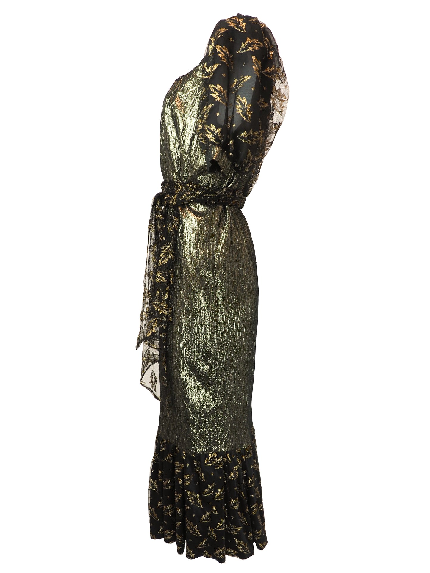 A vintage 1980s metallic gold and black patterned midi dress with puff sleeves, a matching waist tie, and a ruffled hem