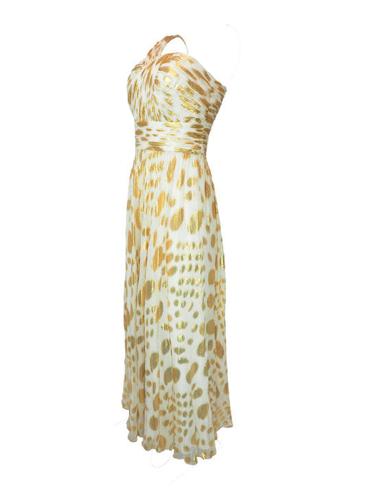 A vintage halter-neck maxi dress with a gold and cream animal print pattern, featuring a ruched bodice and a flowing skirt.