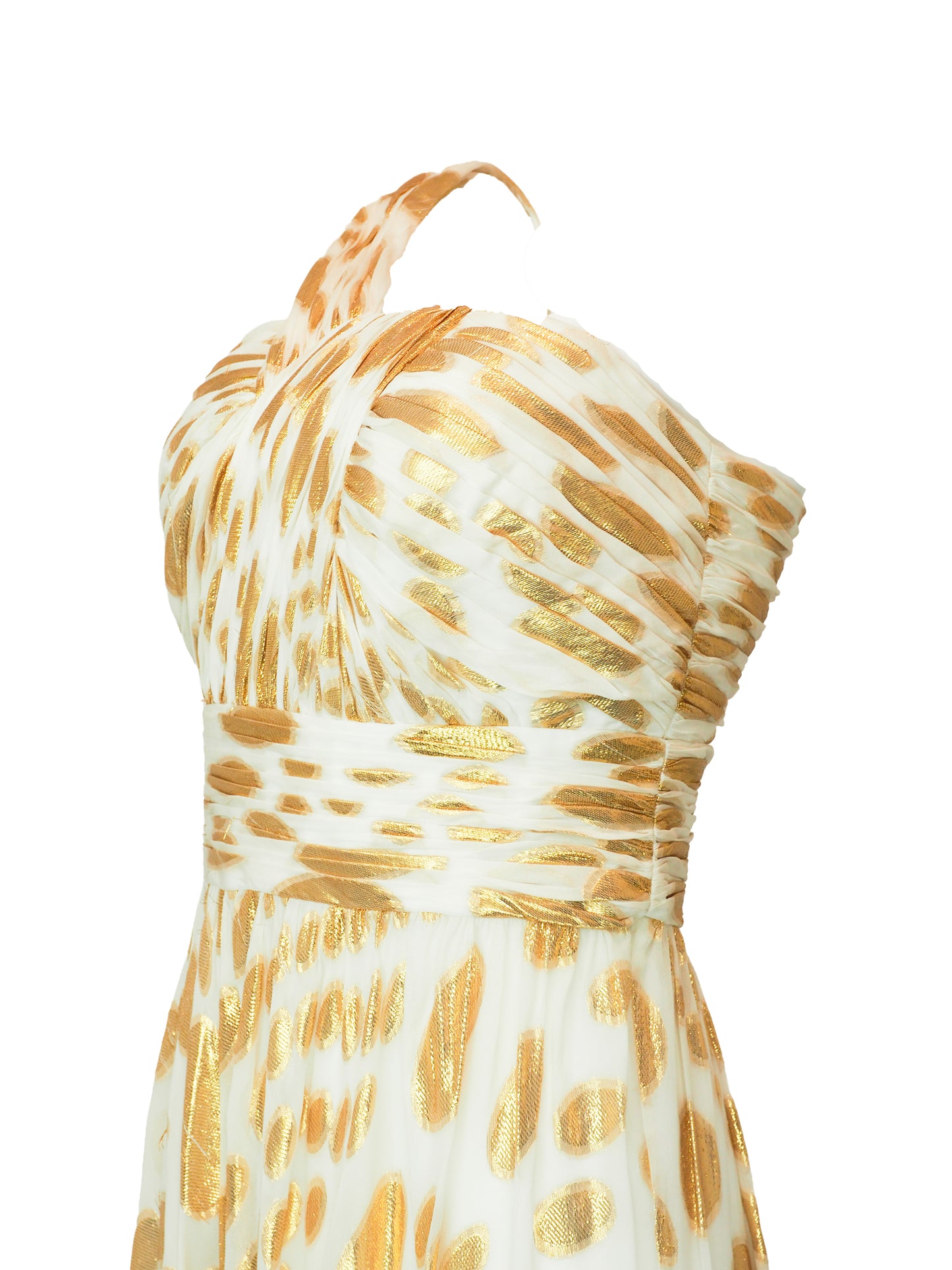 A vintage halter-neck maxi dress with a gold and cream animal print pattern, featuring a ruched bodice and a flowing skirt.