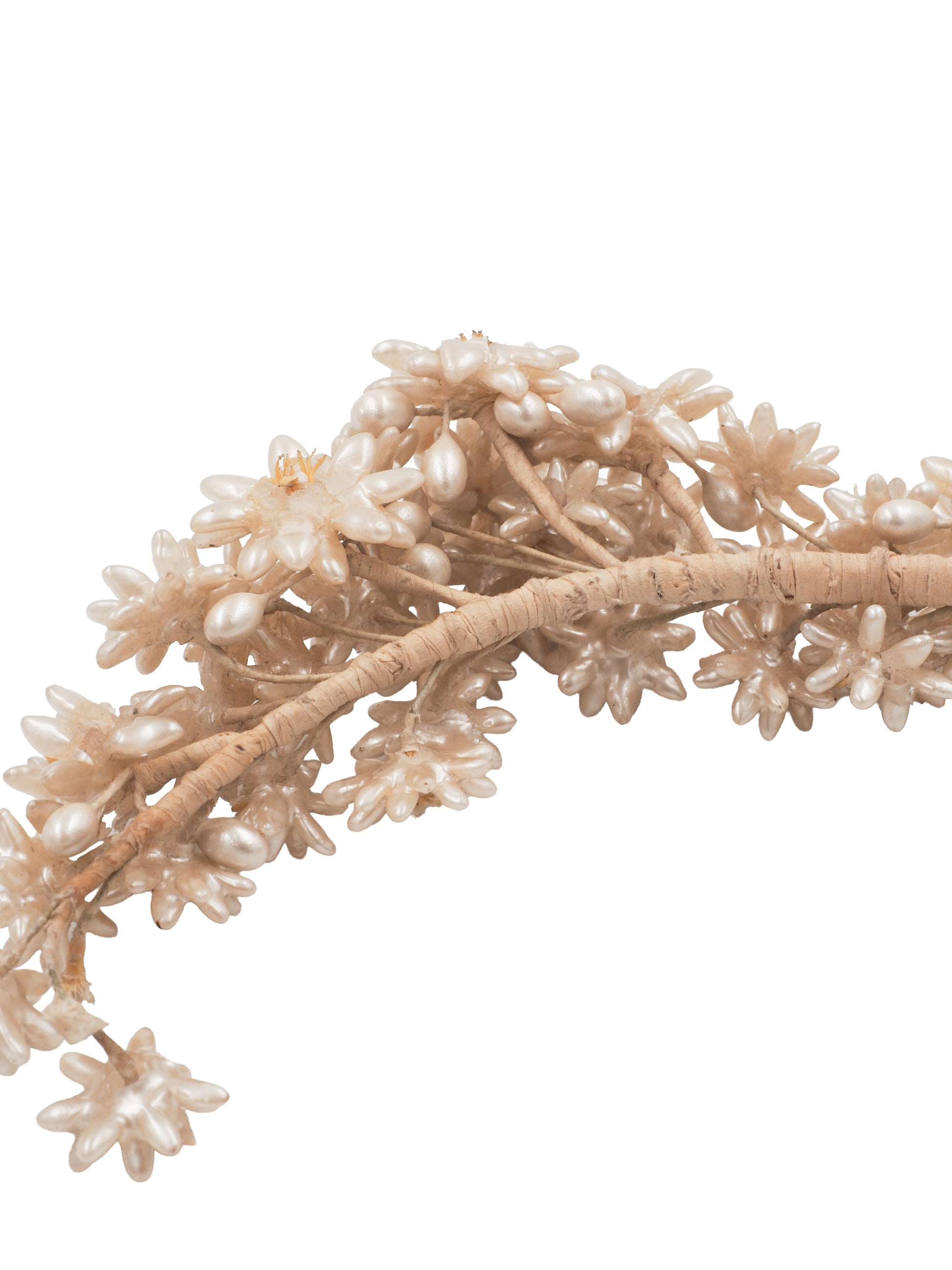 A vintage wedding delicate floral headband featuring small cream-colored faux flowers and branches