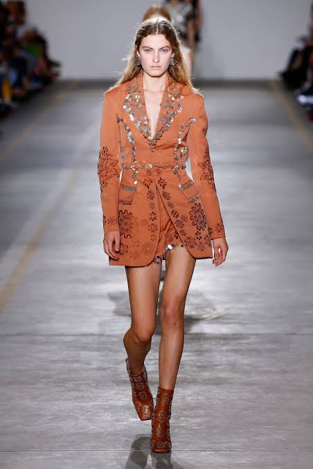 A vintage Roberto cavalli blazer from 2019 rust-orange tailored jacket embellished with silver coin fringe and brown embroidered floral patterns