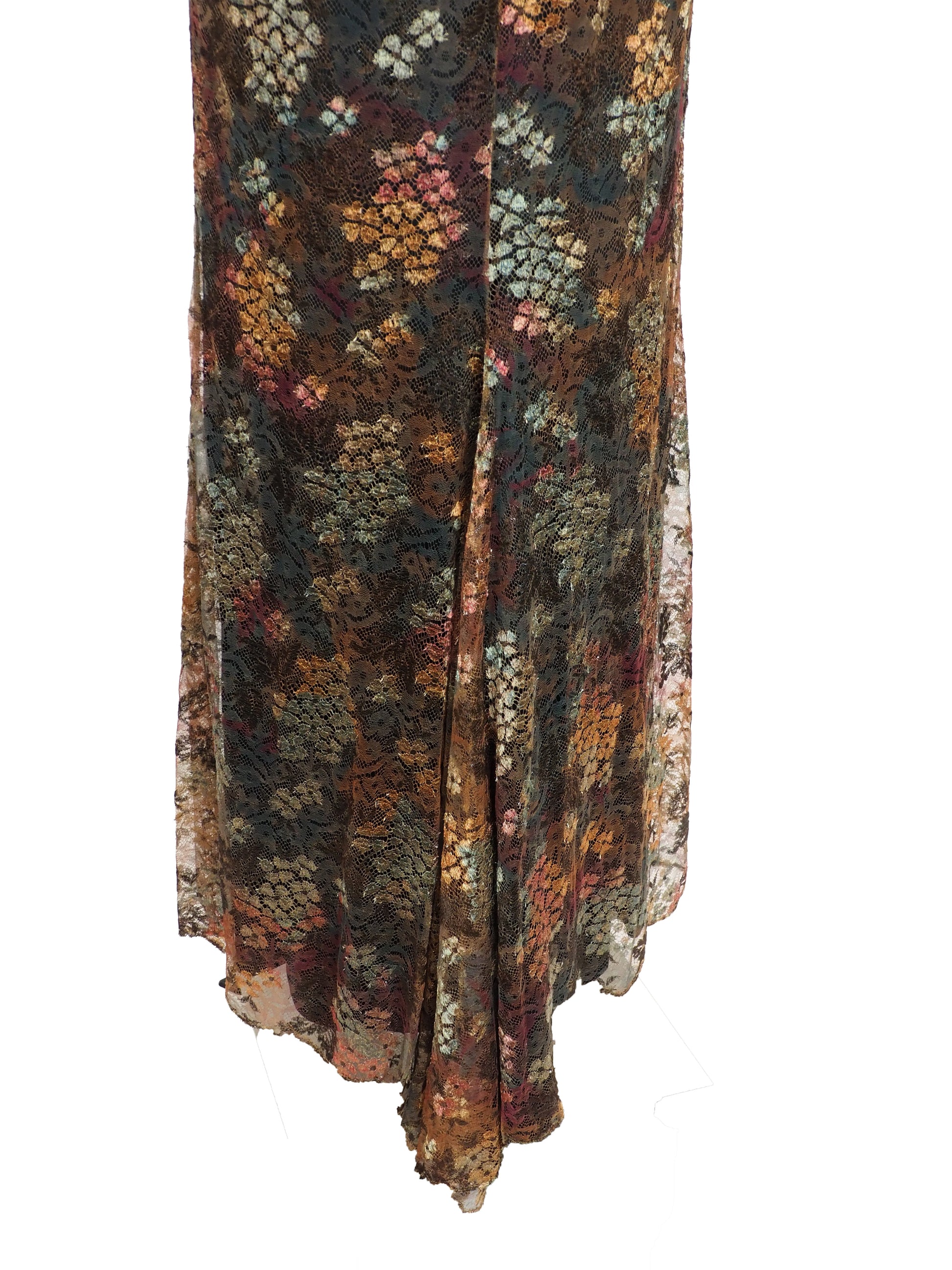 A vintage christian Lacroix runway sleeveless maxi dress with a sheer floral lace pattern in earthy tones of brown, green, and gold, featuring a cream lace bodice and a dark brown satin waist tie