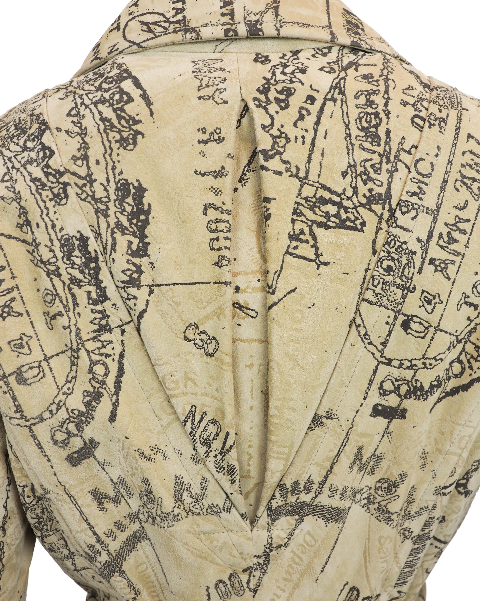 A Diane Von Furstenberg beige trench coat with an all-over black vintage map and script print, featuring a double-breasted design with brown buttons and a matching waist tie, shown against a plain white background.